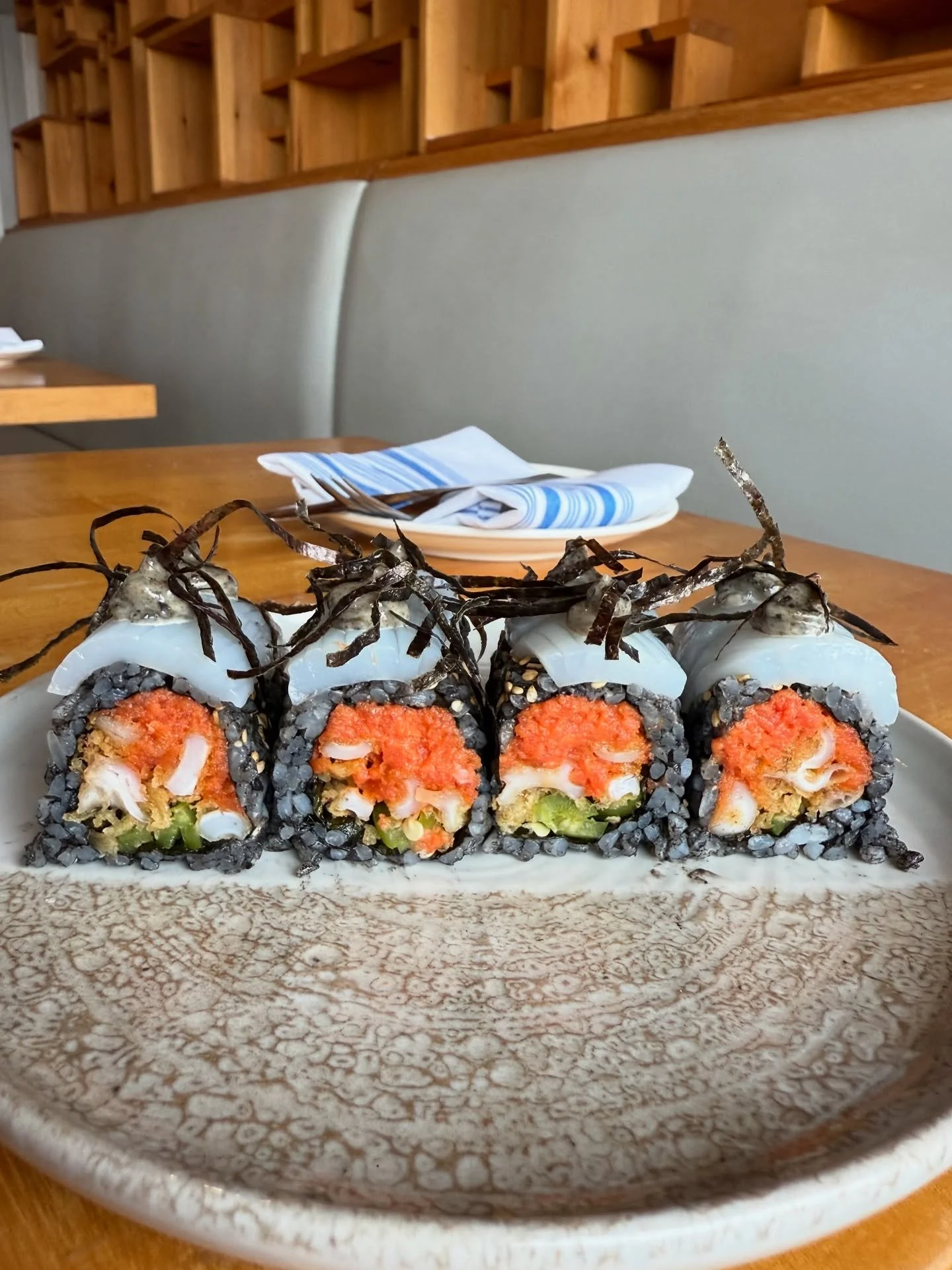Kraken Roll- Squid ink rice, fried calamari, spicy tuna, jalape&ntilde;o; squid sashimi &amp; nori mayo