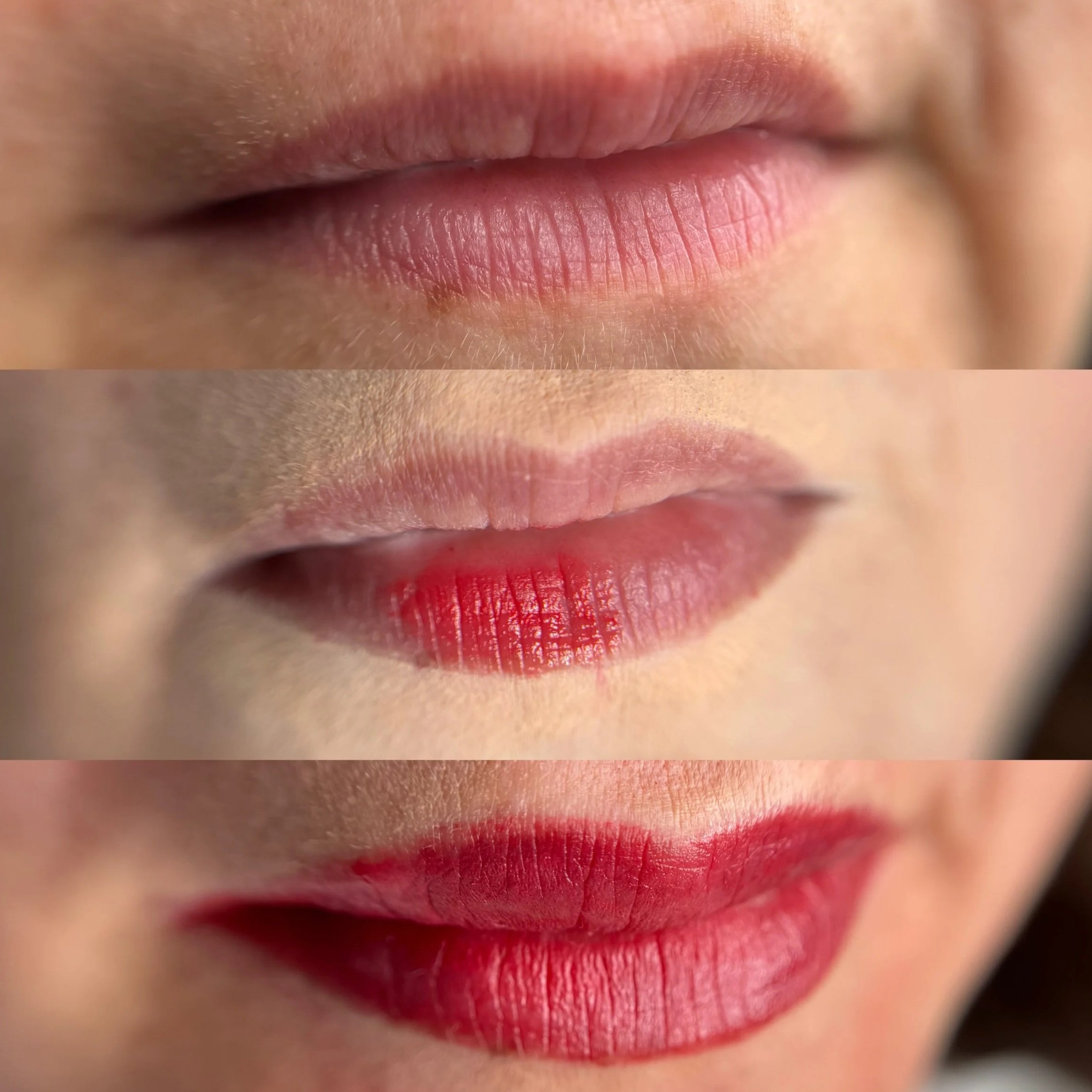 Nahaufnahme von roten Lippen mit Lippenstift, Blende auf den unteren Lippen. Die Haut um die Lippen ist glatt und hell.