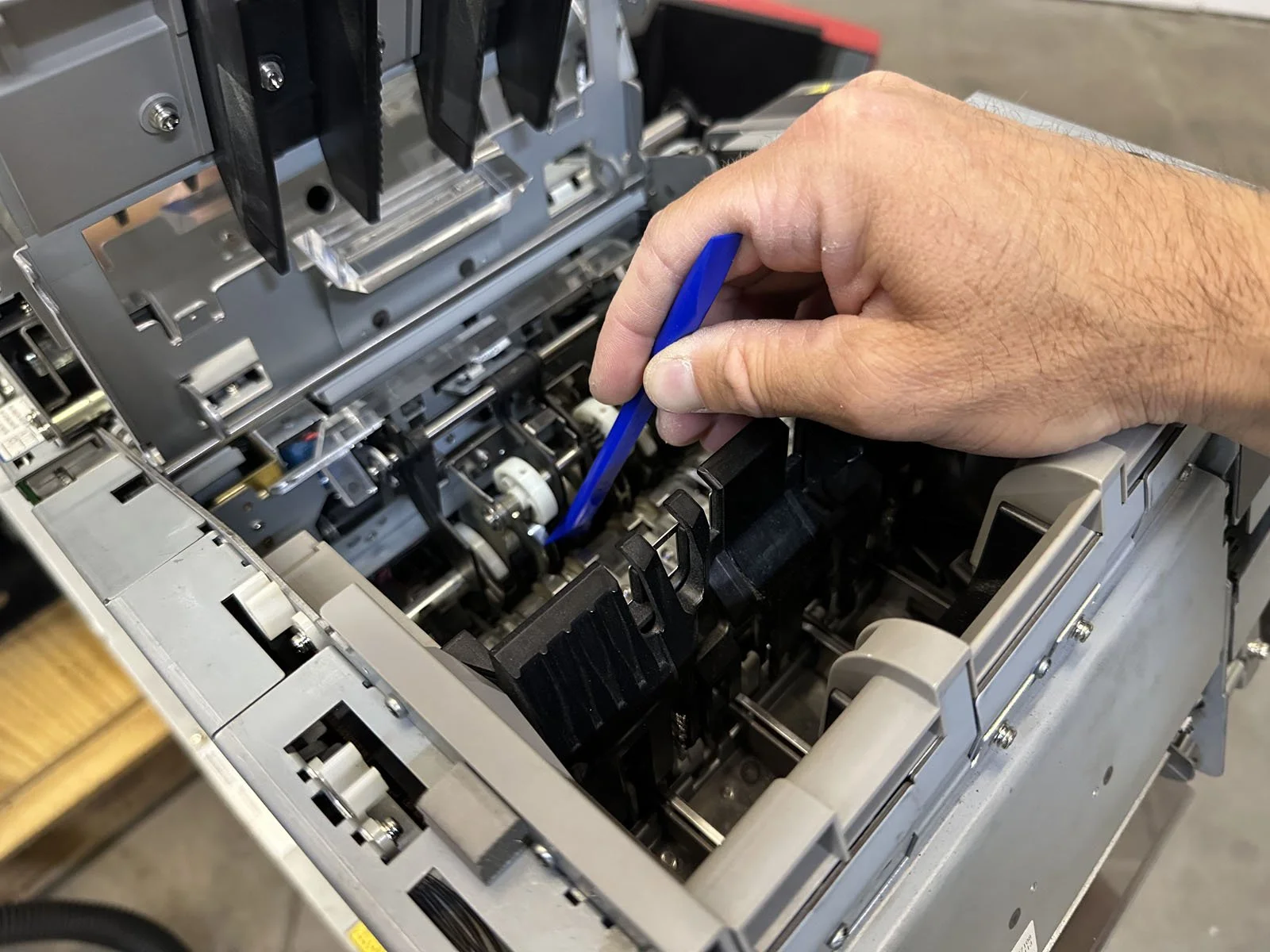 Plastic Scraper on Metal Rollers