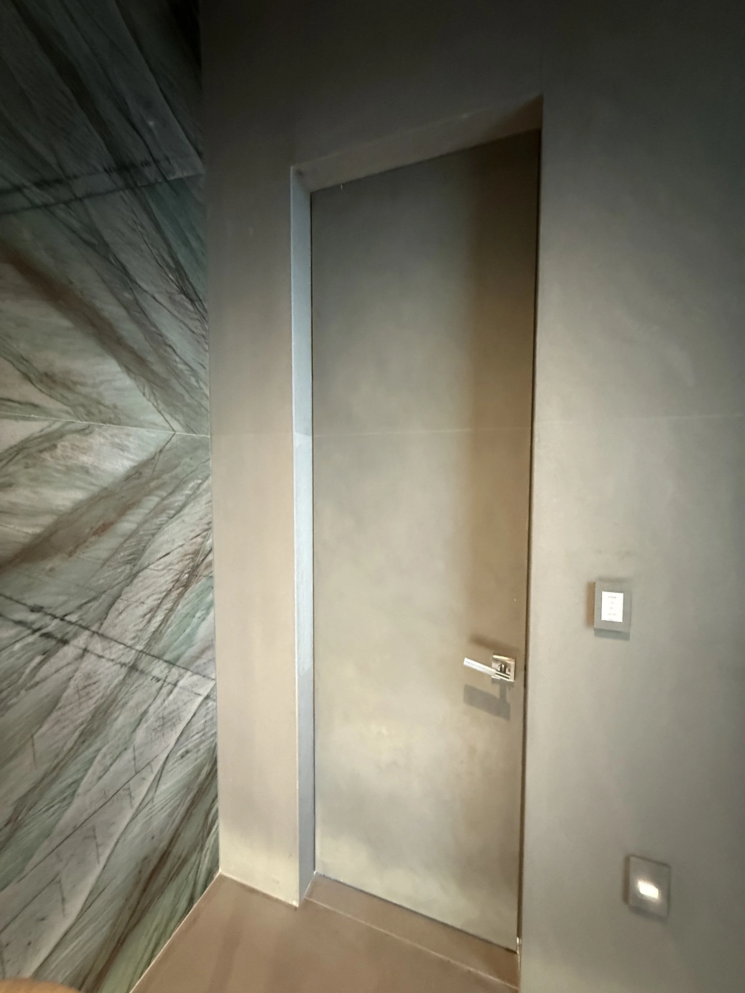 Faux stone door to match stone surrounding it