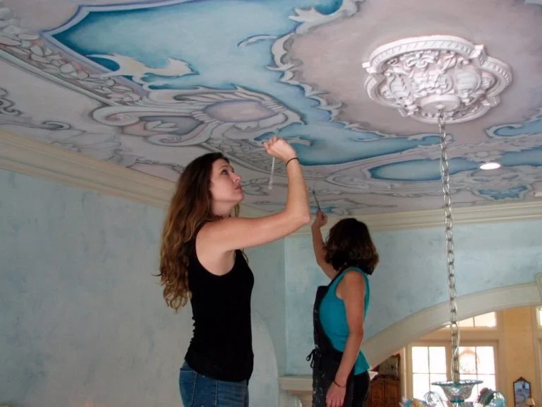 Hand painting a ceiling mural