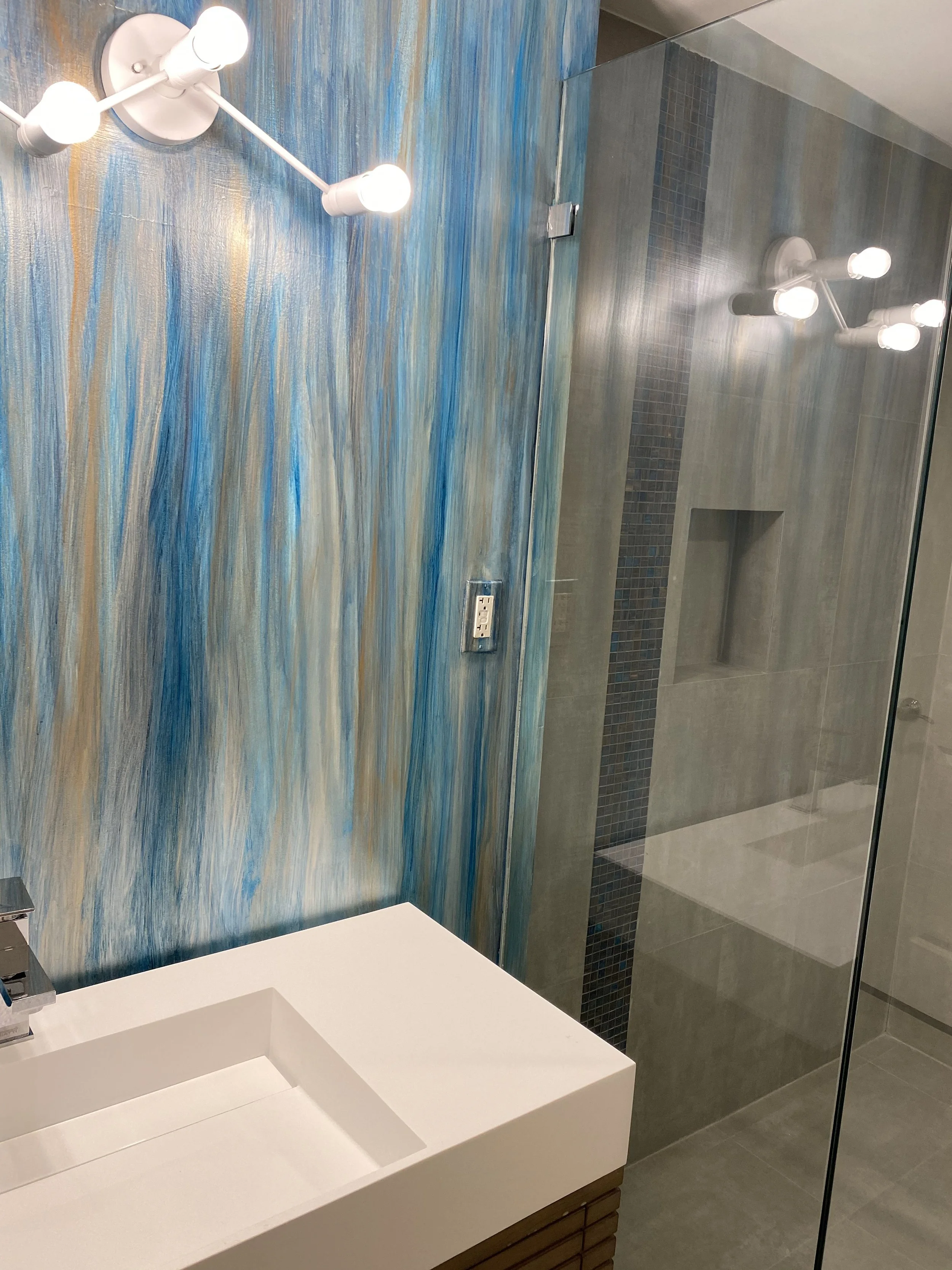 Metallic hand painted wallpaper in bathroom