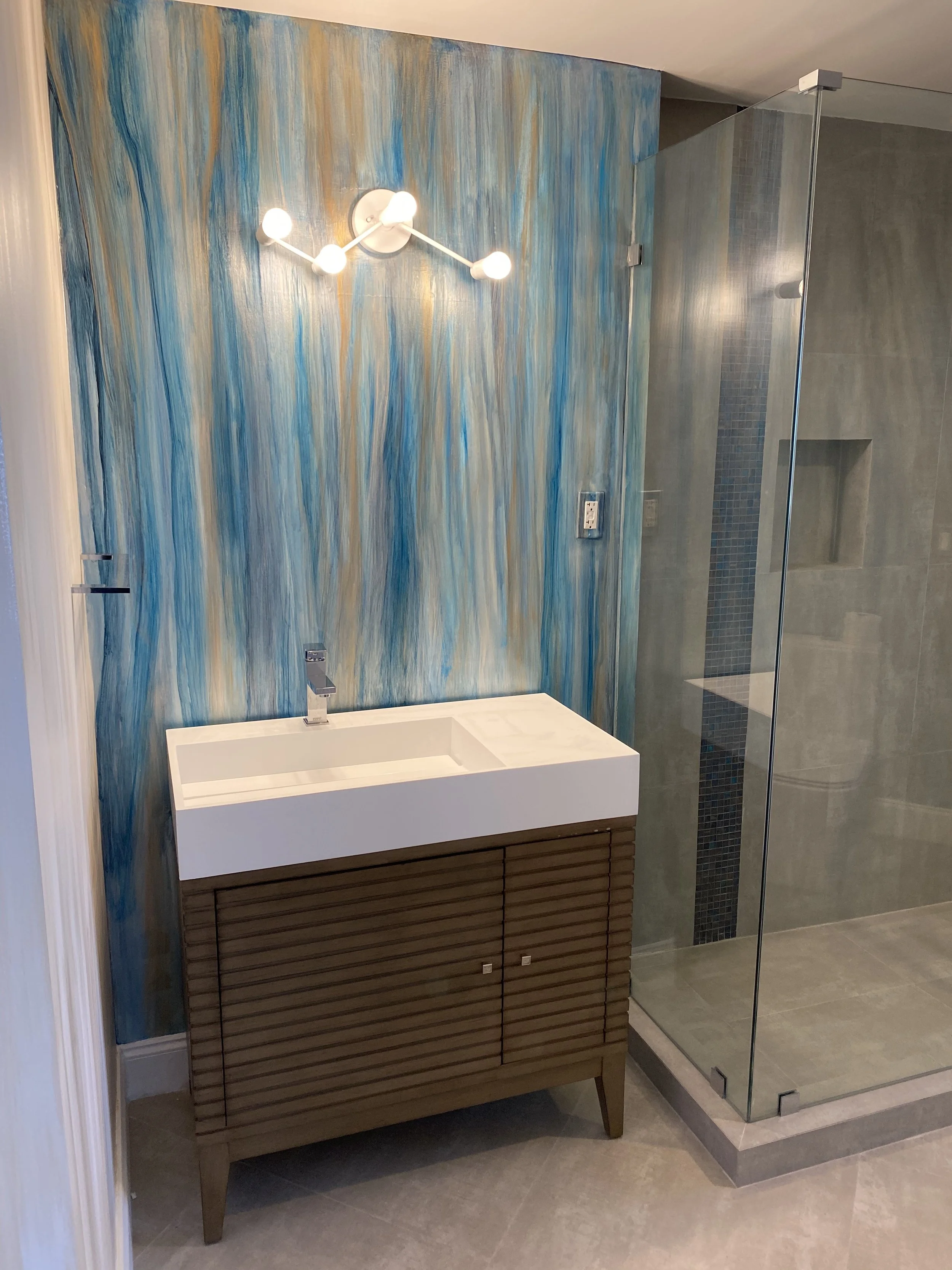 Metallic hand painted wallpaper in bathroom