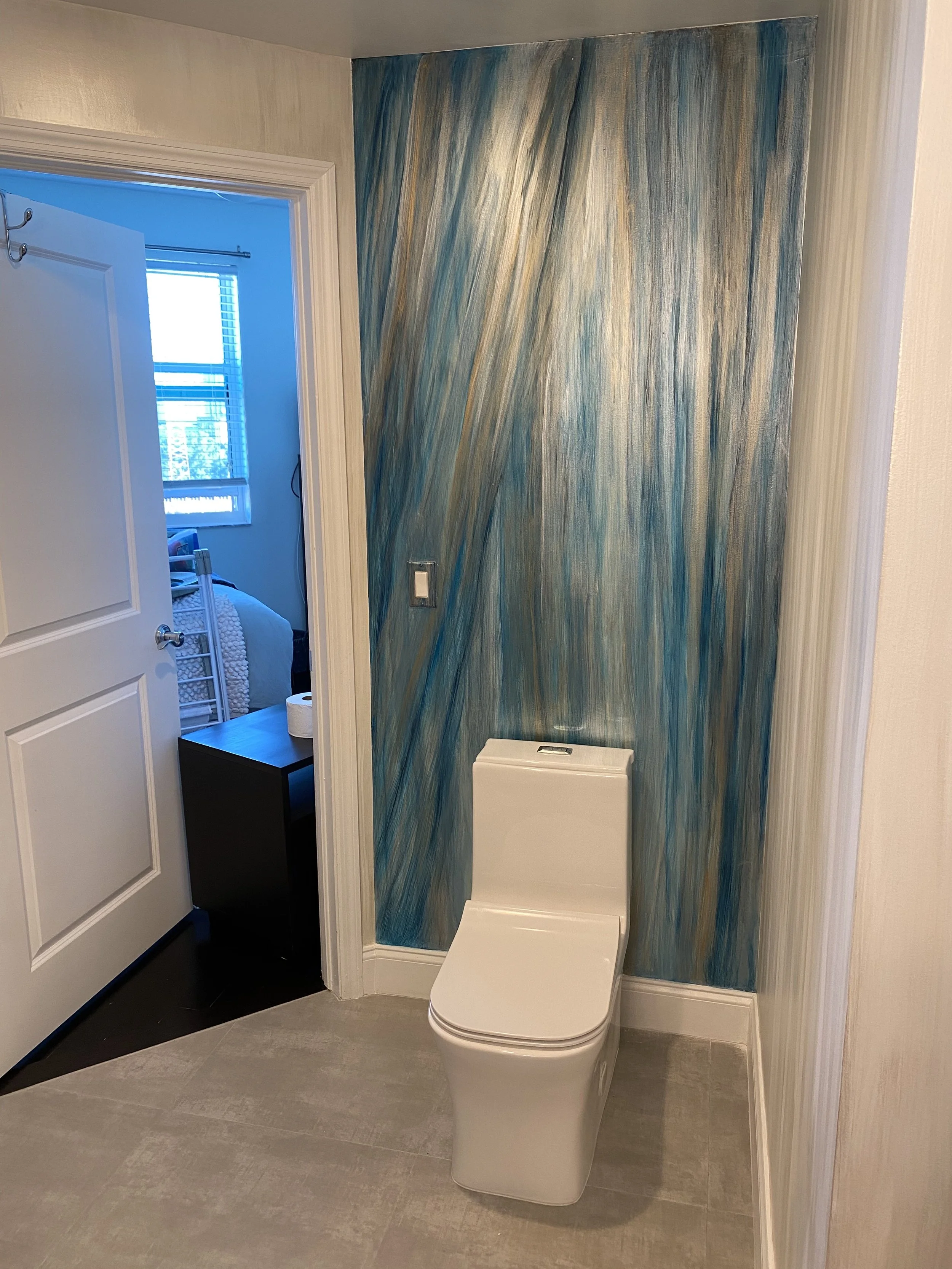 Metallic hand painted wallpaper in bathroom