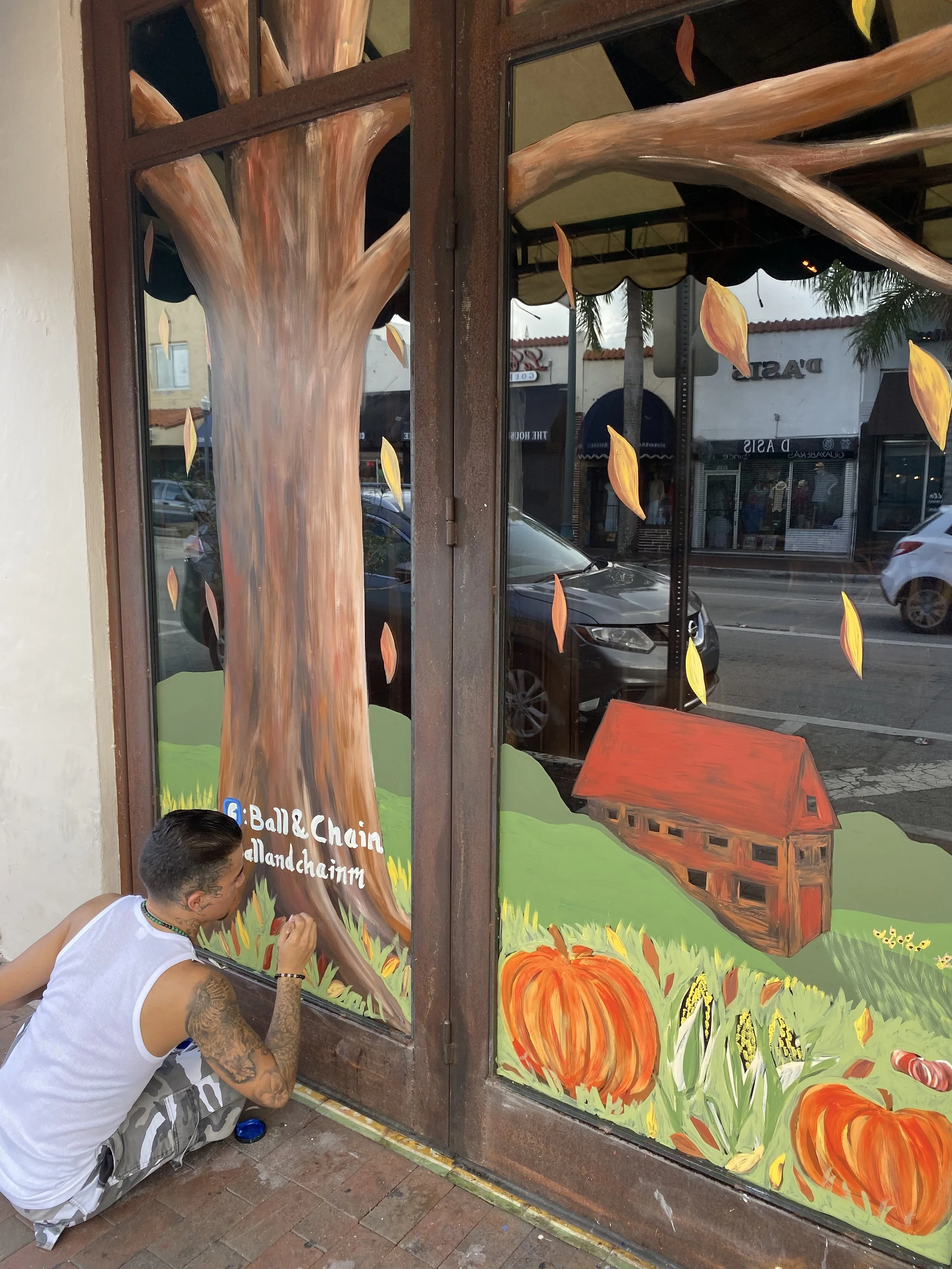 Seasonal window murals at Ball and Chain, Miami, FL