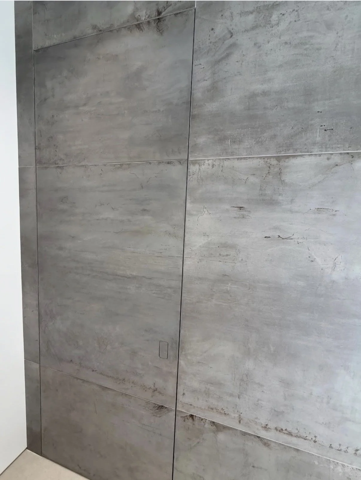 Faux door to match real stone around it