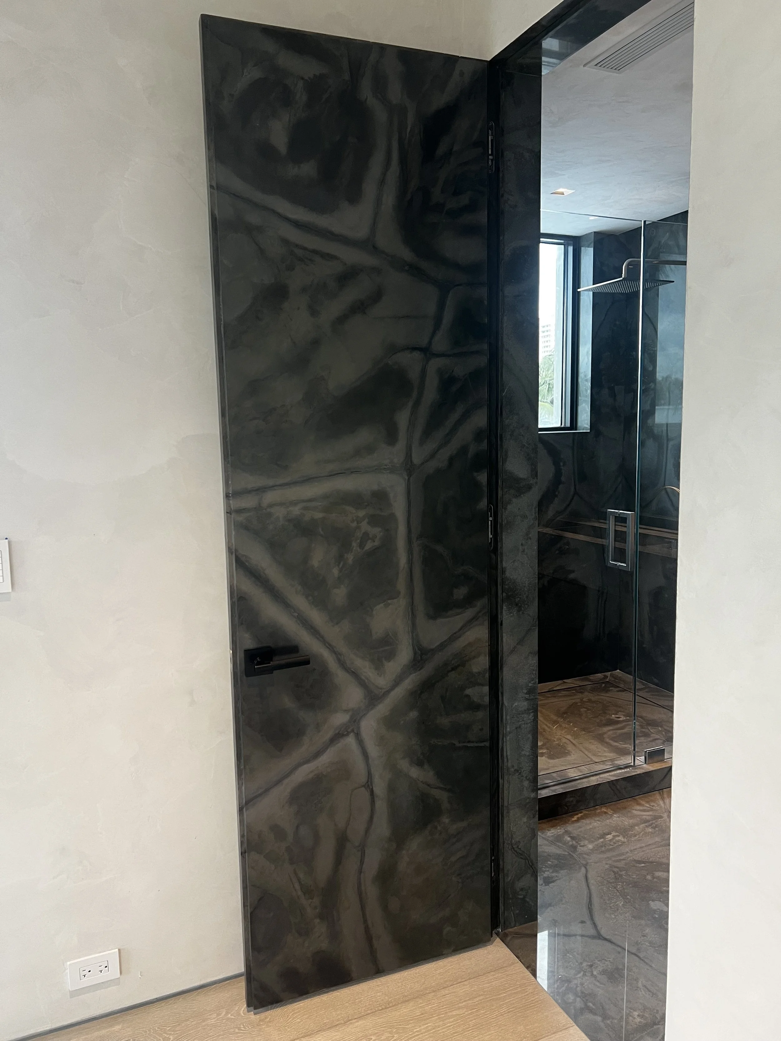 Faux granite door to match the real granite surrounding it