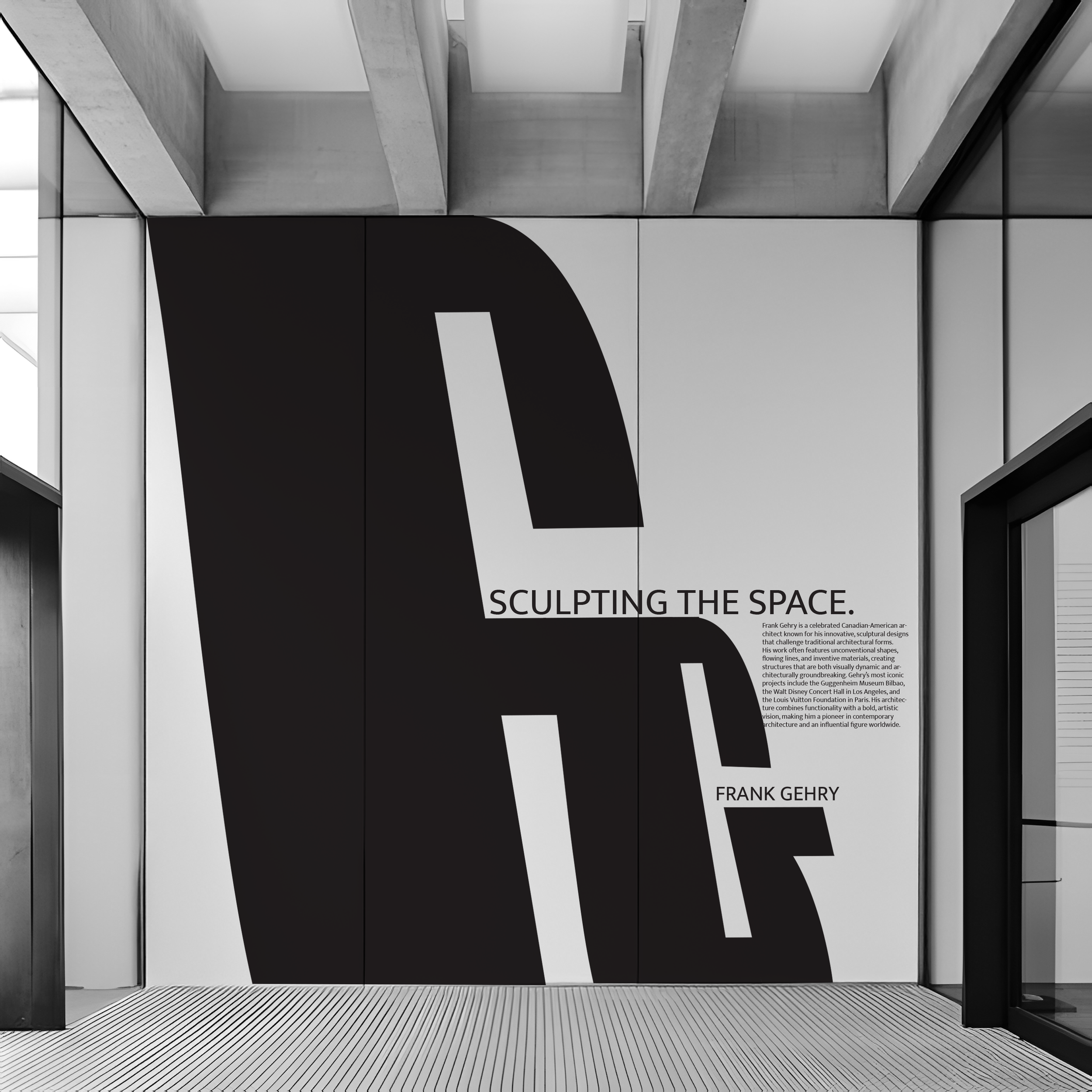 Wall display with large black and white lettering and smaller text about Frank Gehry and architectural sculpture in a modern interior space.