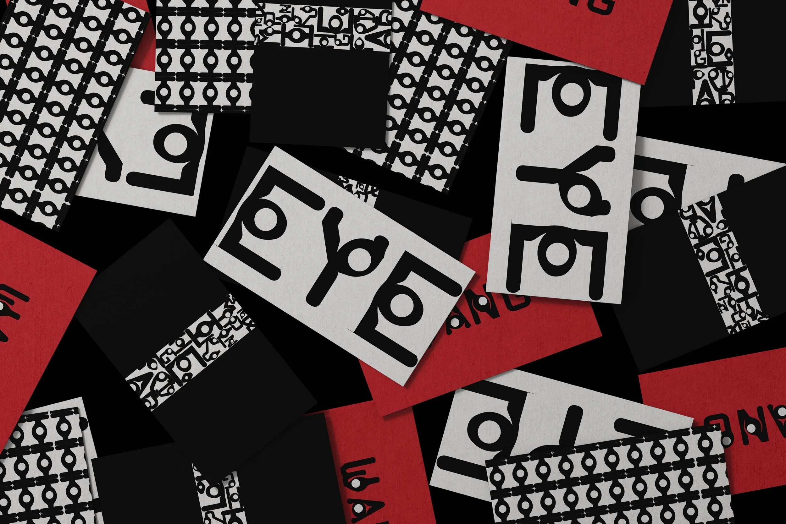A scattered assortment of black, white, and red tickets with a repeating geometric pattern, some displaying a pair of scissors icon.