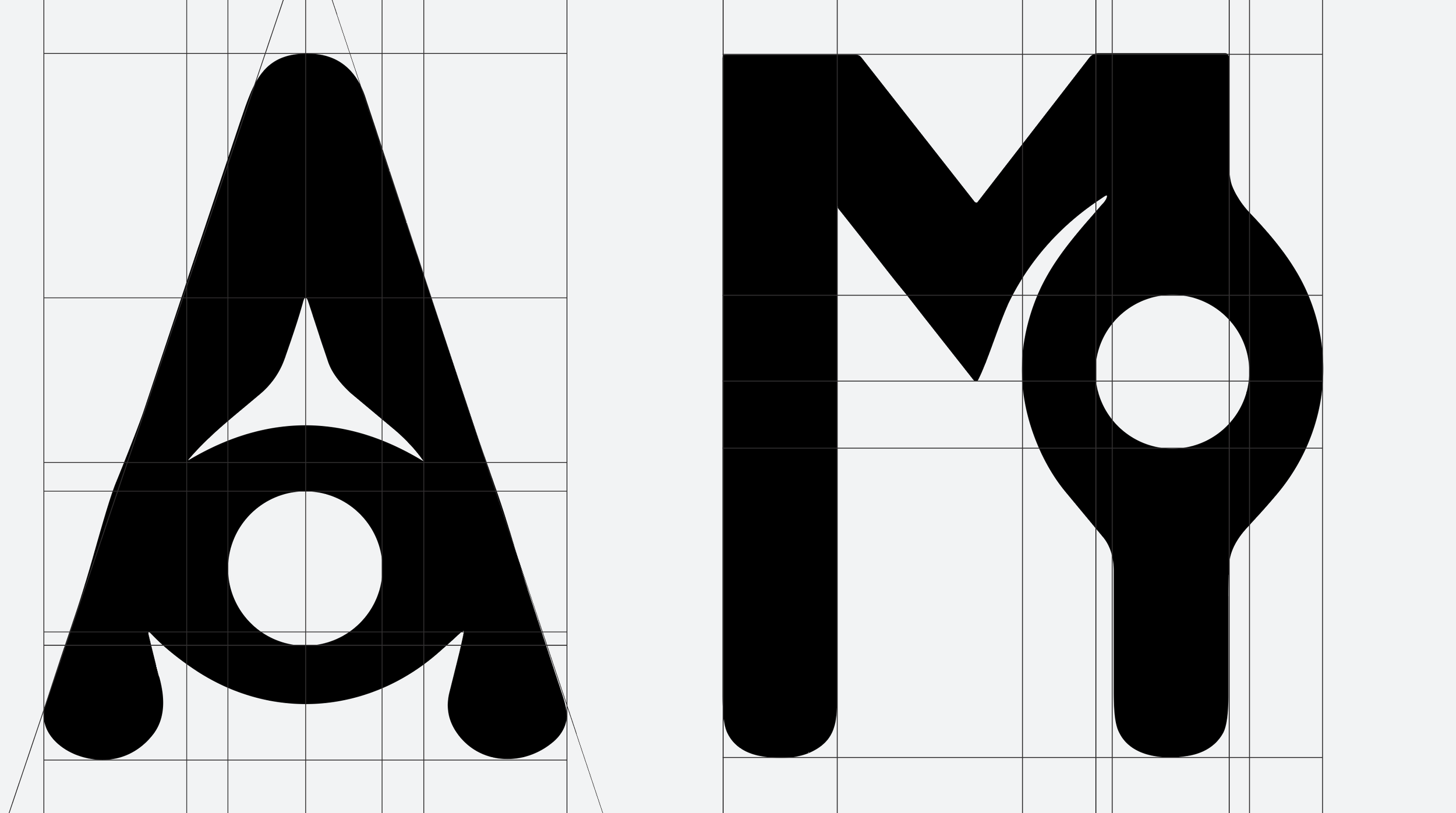 Close-up view of stylized black letters 'A' and 'Y' on a gray background with grid lines.