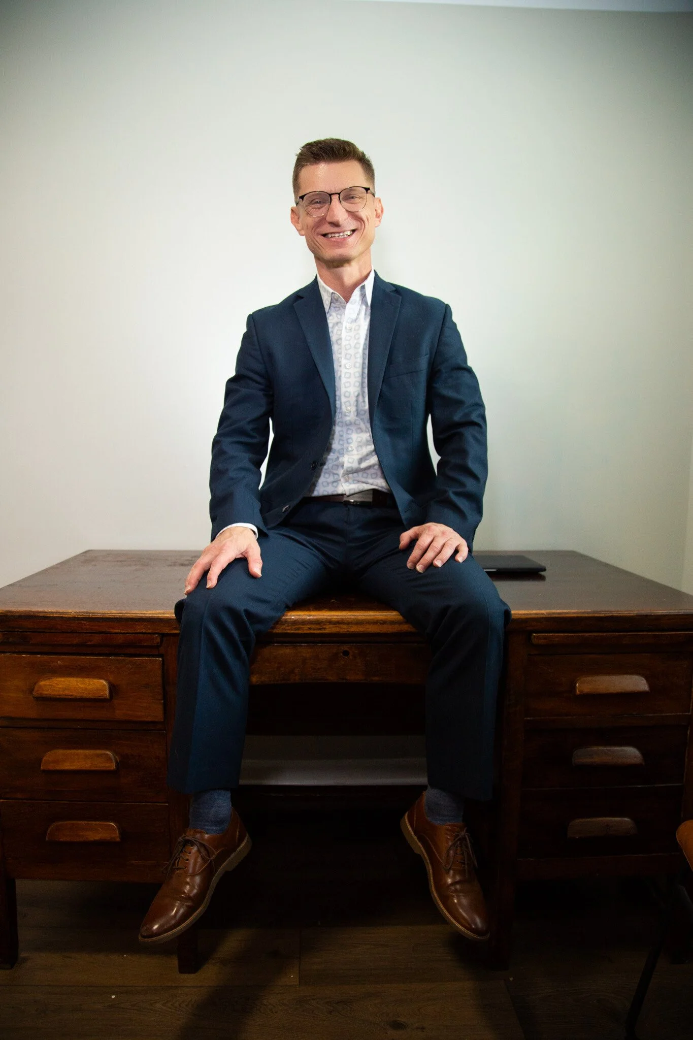 Dr. Danny G., The Leadership Alchemist, seated in a professional learning environment