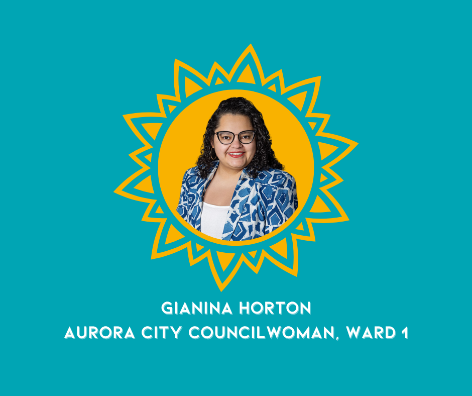 A woman with curly dark hair and glasses, dressed in a blue patterned blazer, smiling against a yellow sunburst graphic on a teal background. Text below reads 'GIANINA HORTON, AURORA CITY COUNCILWOMAN, WARD 1'.