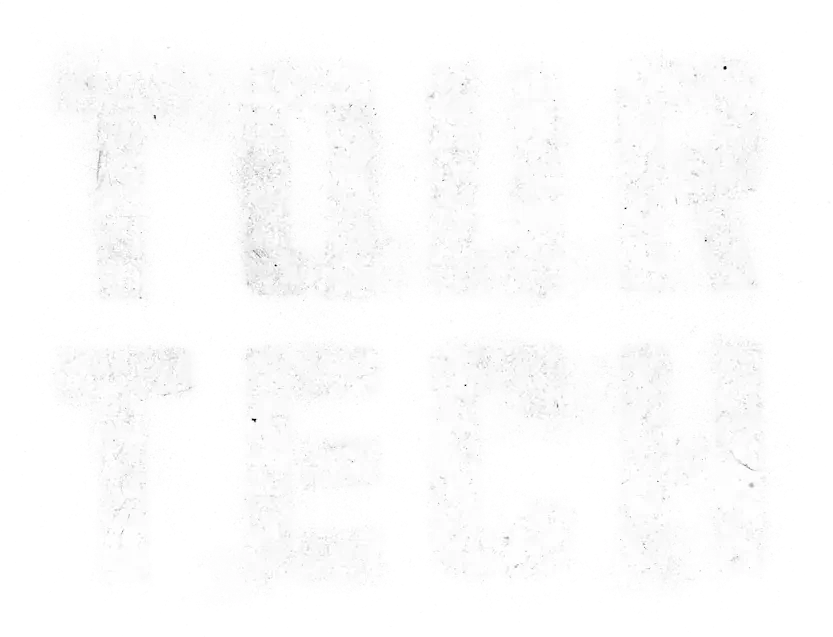 A blank, slightly textured white background 'TOUR TECH' logo with some black specks and smudges.