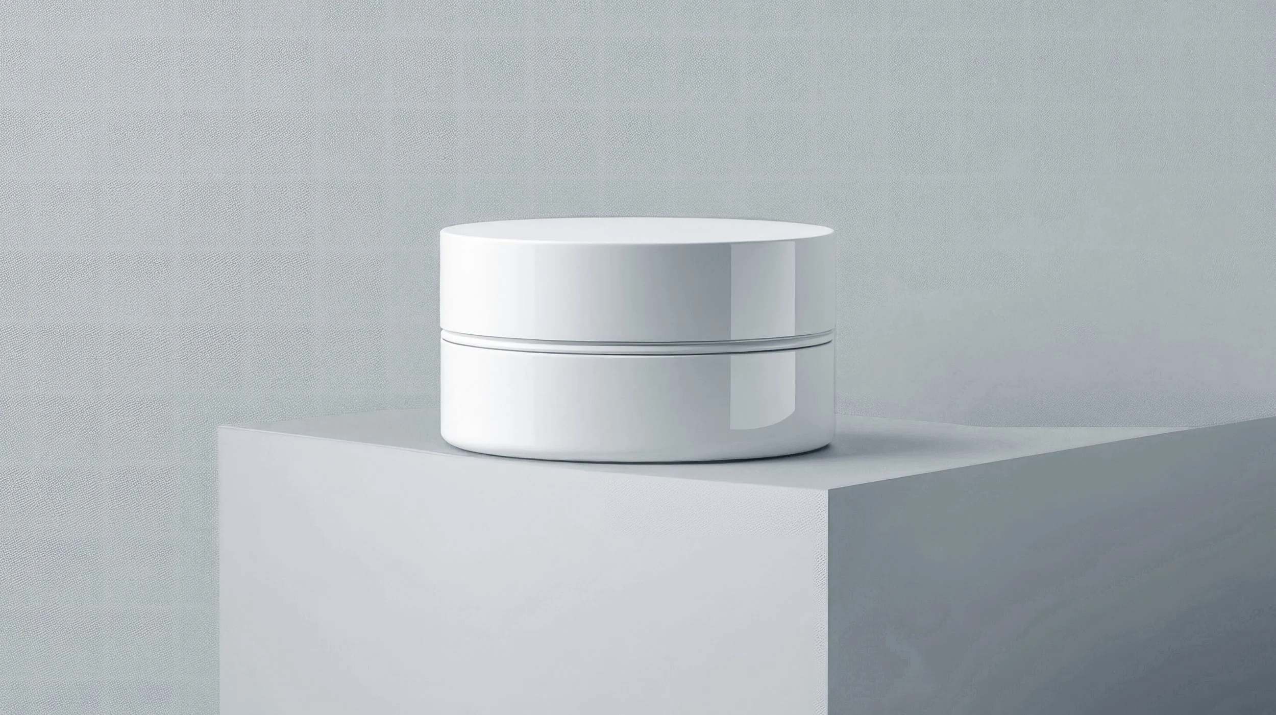 A white, round cosmetic container on an orange platform against an orange background.