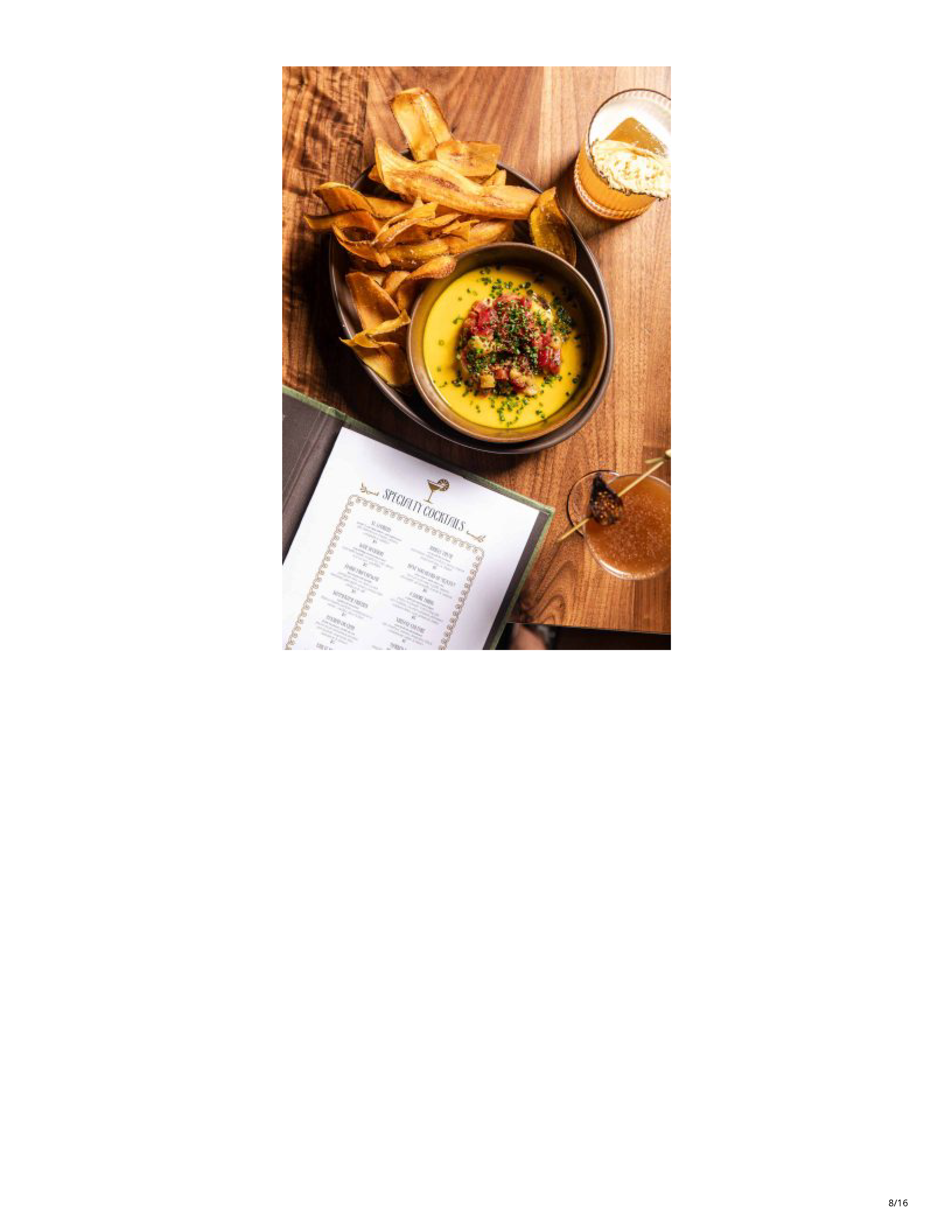 Cocktail, plantain chips and dip presented with Filthy Animal’s specialty cocktail menu.