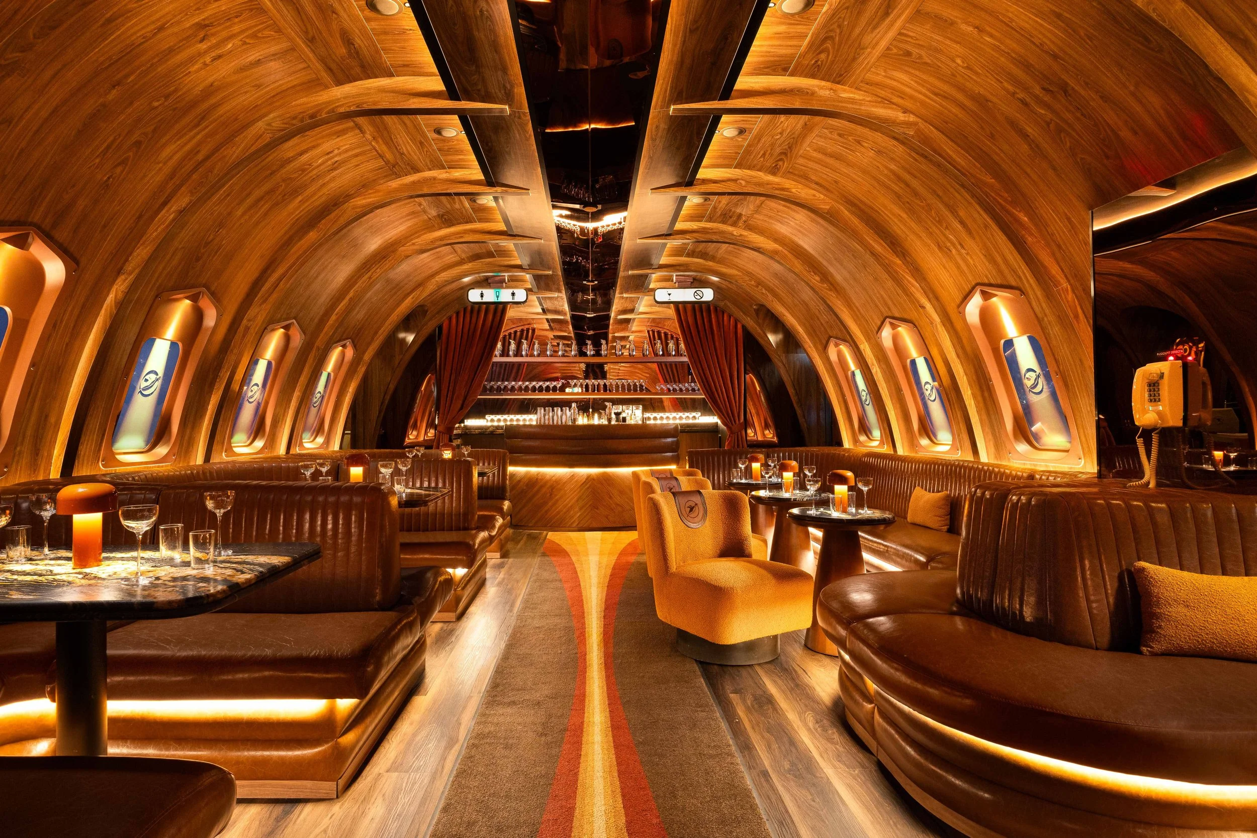 Hospitality Design Awards listing showing Carry On Airlines in Phoenix as a winner and Powder Room in Austin as a finalist, with PETERMAX Co. identified as the interior design firm for both projects.