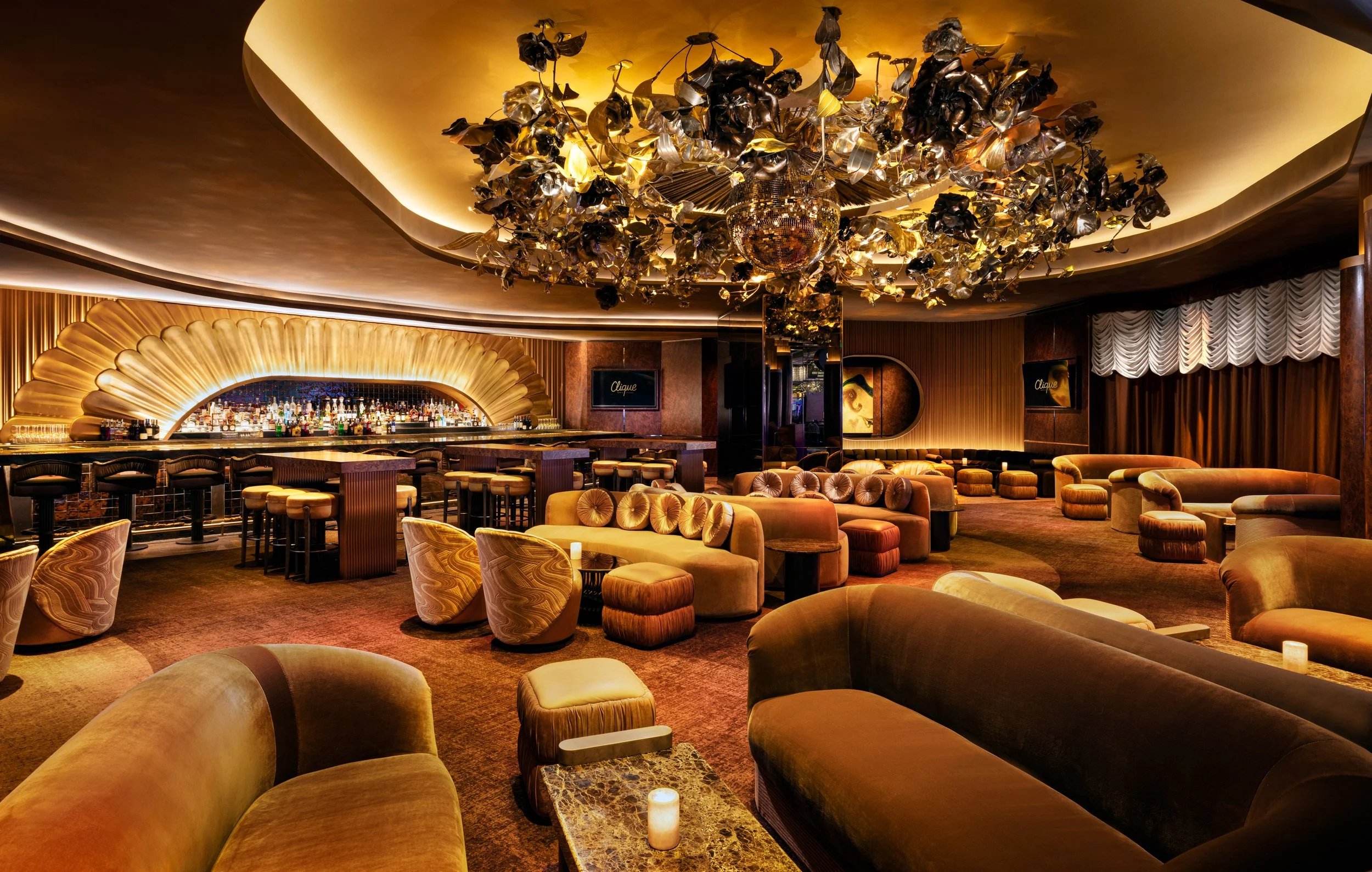 Remodeled Clique Bar & Lounge at The Cosmopolitan of Las Vegas, designed by Peter Max Bowden with glowing copper and amber tones.