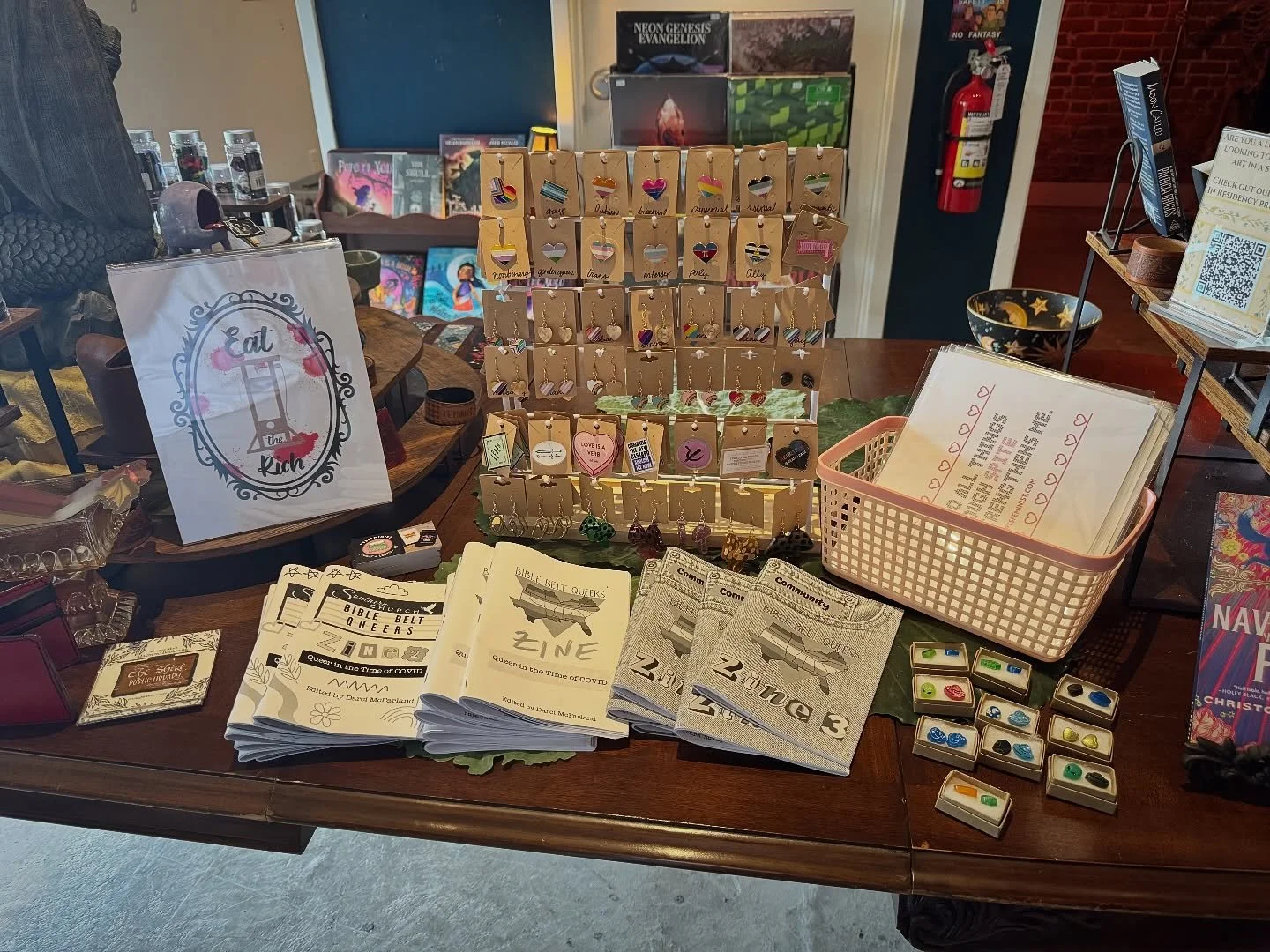 @ptsfeminist is one of the amazingly talented artists we&rsquo;ll be carrying this month in Pocket Dimension! PTSFeminist specializes in feminist &amp; queer art, zines, &amp; handmade jewelry. ✨🔥

Their art is PERFECT for Pride Month! And we&rsquo;