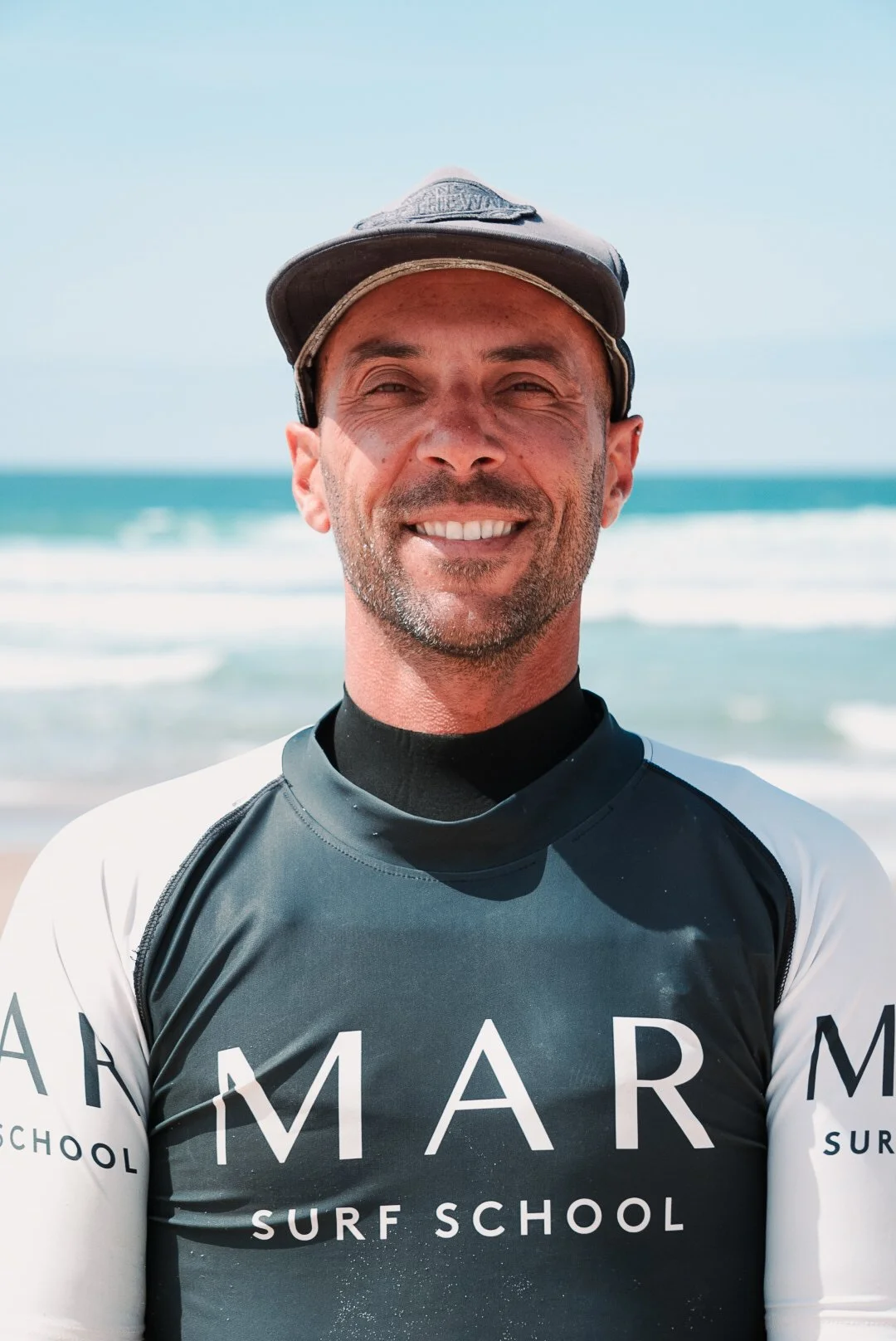 Portrait of a smiling man at the ocean.