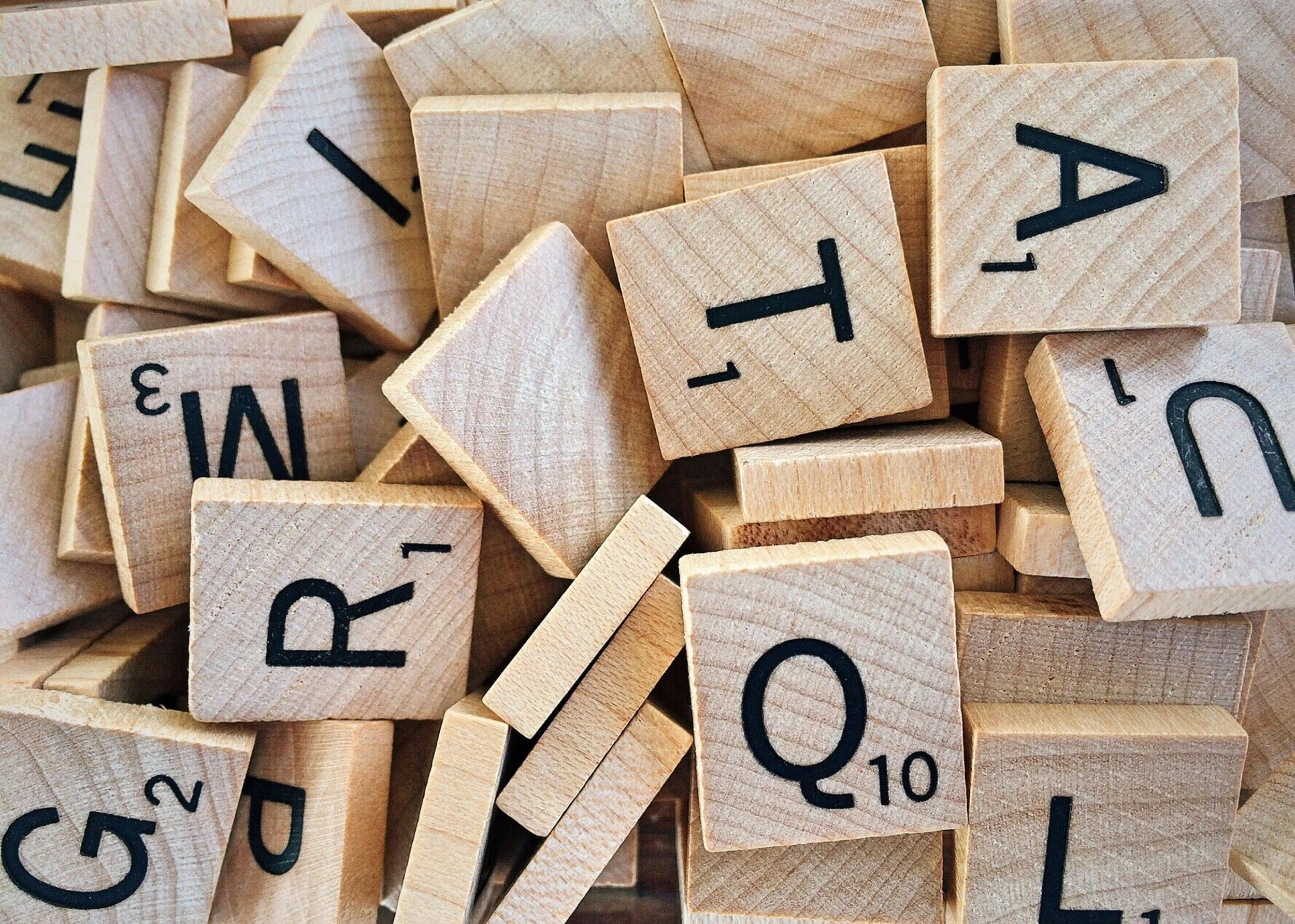 Stock photo of a pile of Scrabble letters.