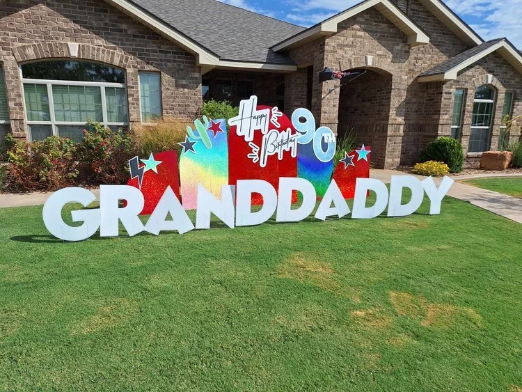 Welcome home yard sign for new homeowners with keys and mailbox in Wolfforth