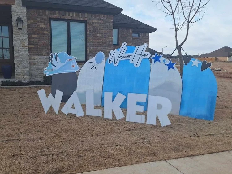 School spirit week lawn display with fun icons and school name in Wolfforth