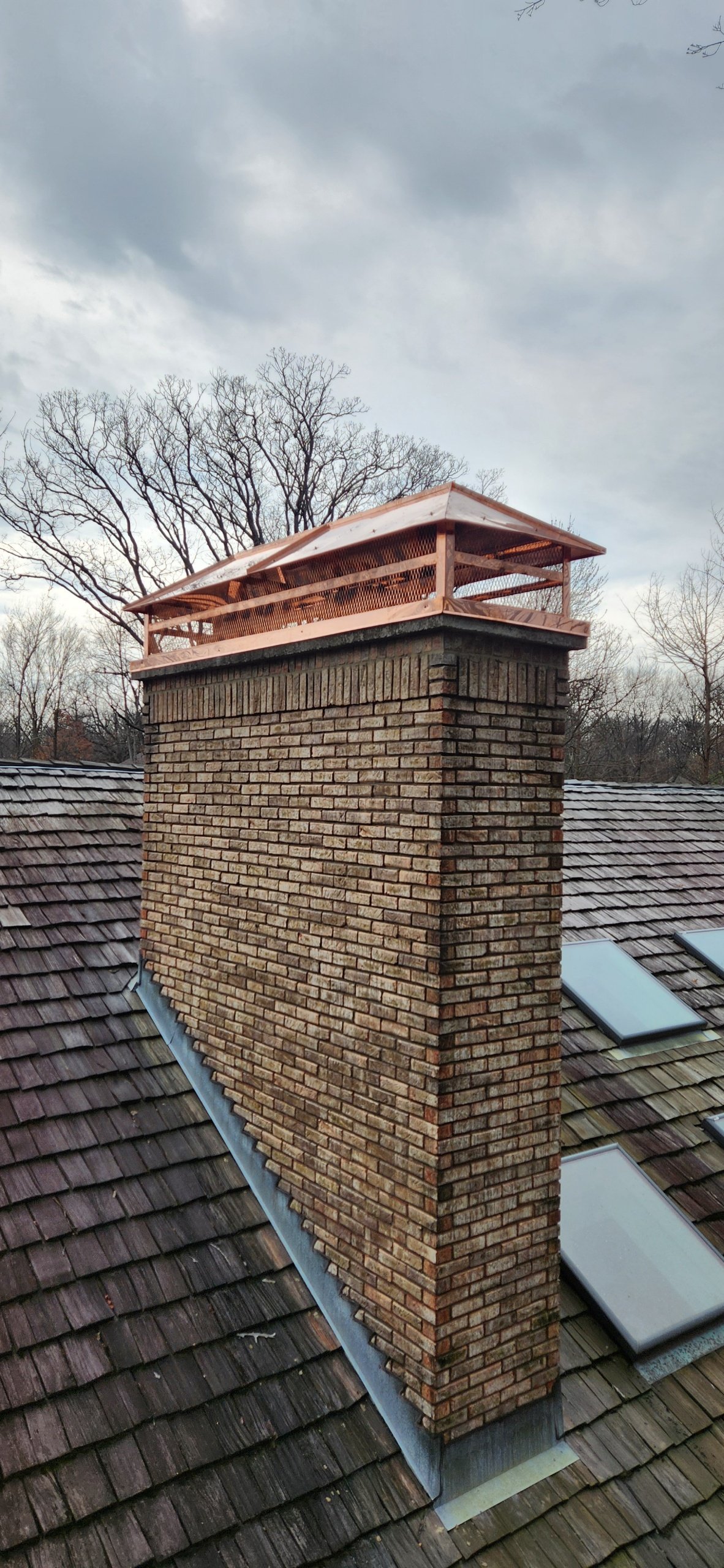 copper cap, chimney services, brown brick, flashing, water leak