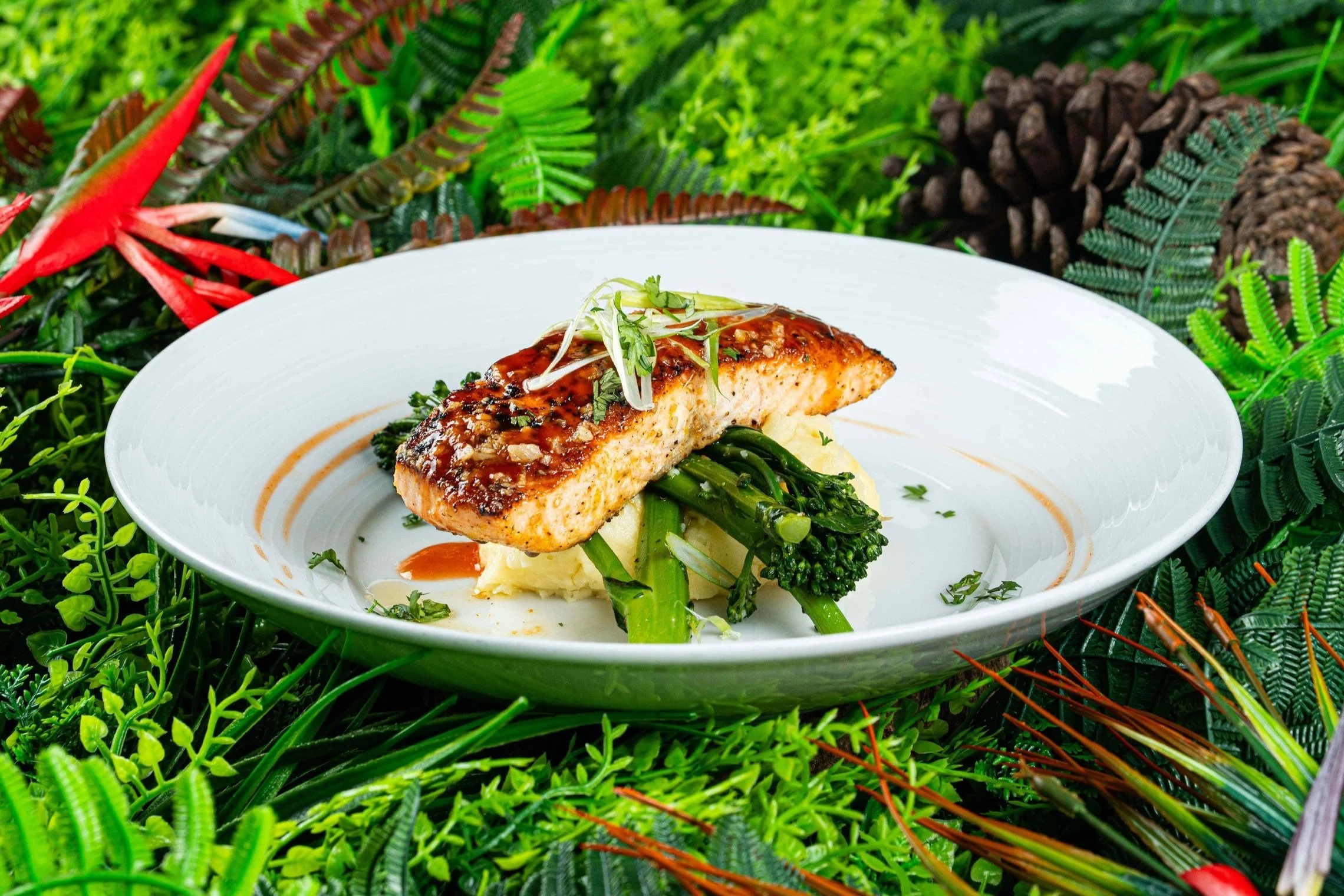 Grilled Salmon is glazed with a delightful mix of spicy sriracha and sweet honey.