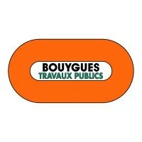 Sign with orange background and white oval, reading 'BOUYGUES TRAVAUX PUBICS'.