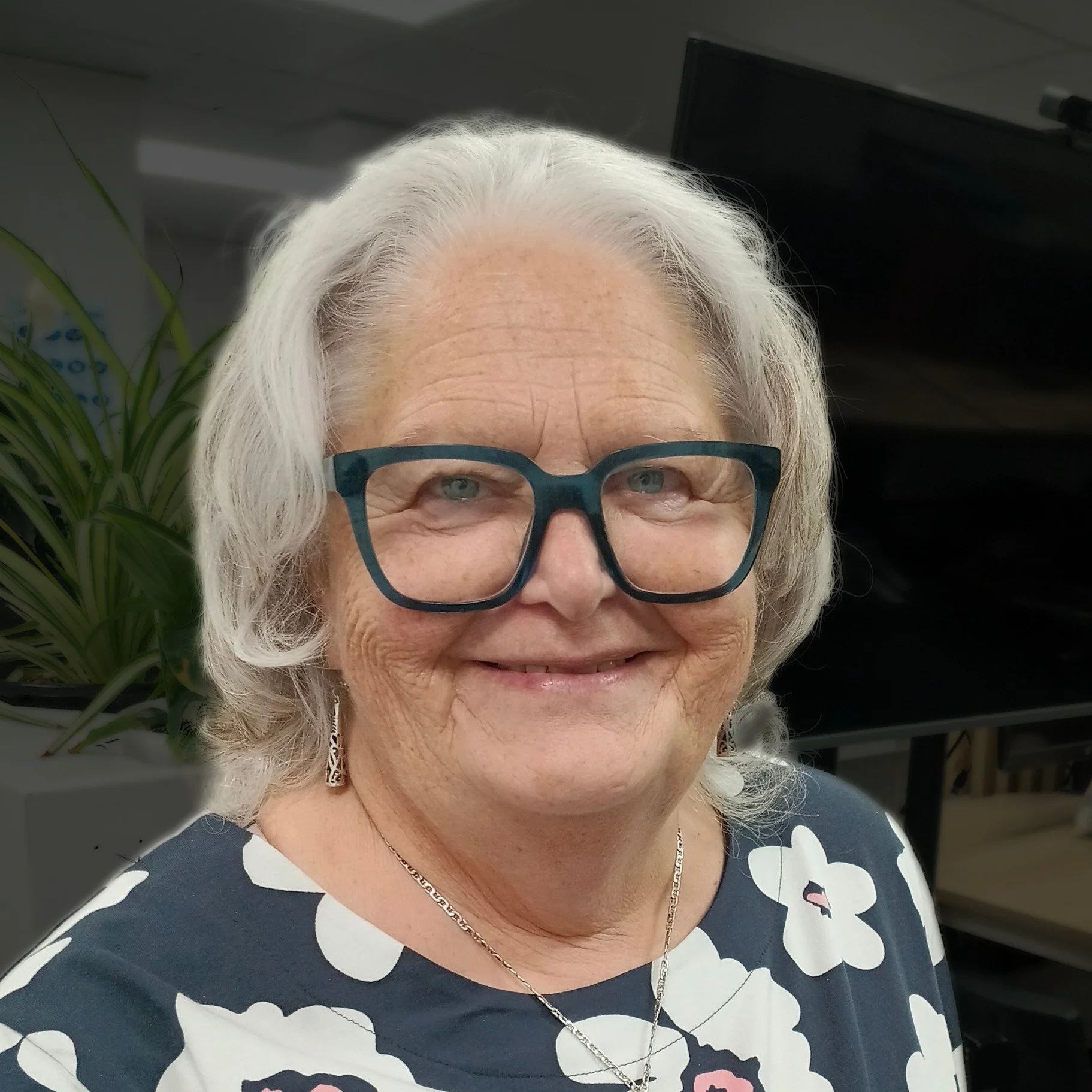 A photo of a woman with grey hair