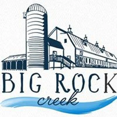 Logo featuring a barn and silo with the words "Big Rock Creek" and a stylized blue creek.