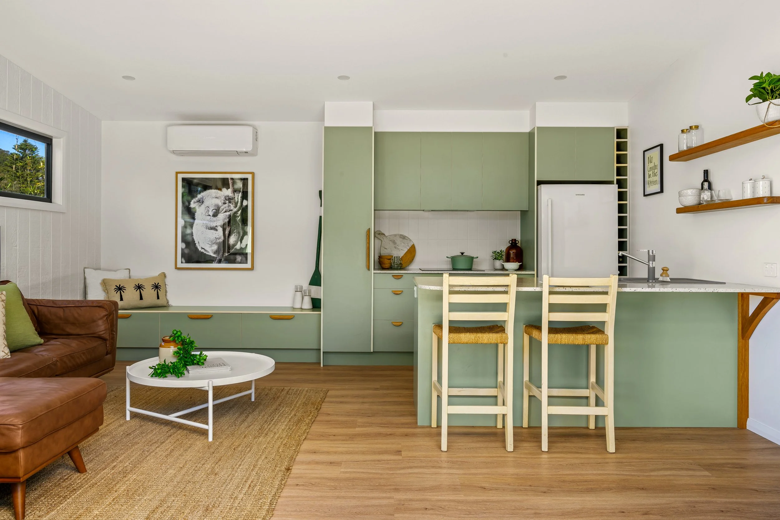 Nordic sage green kitchen and living area in Terrigal Granny Flat property
