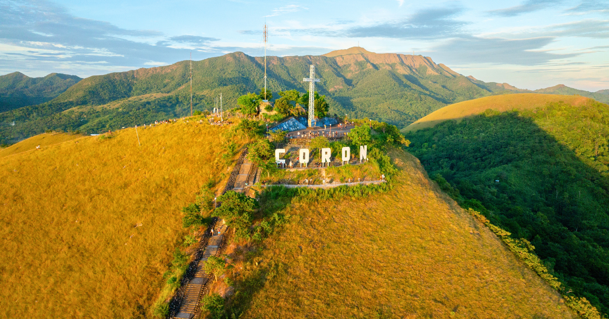 Aerial view of the Coron sign, cross and stairway on the summit of Mount Tapyas