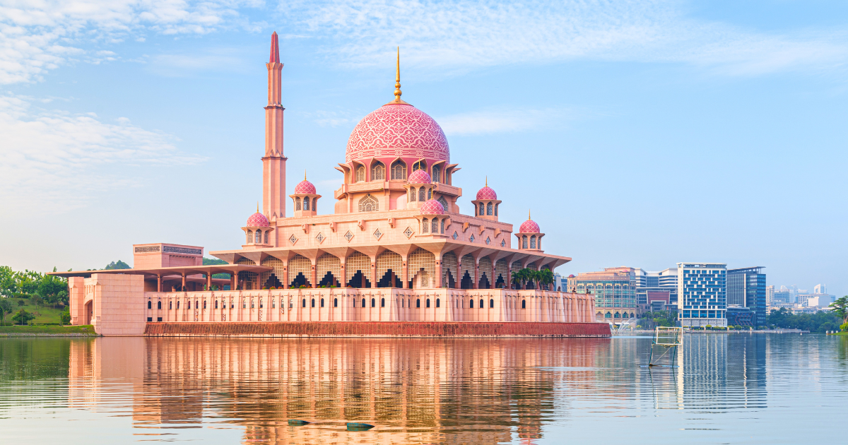 Masjid Putra, the Pink Mosque, reflected in Putrajaya Lake on a clear morning