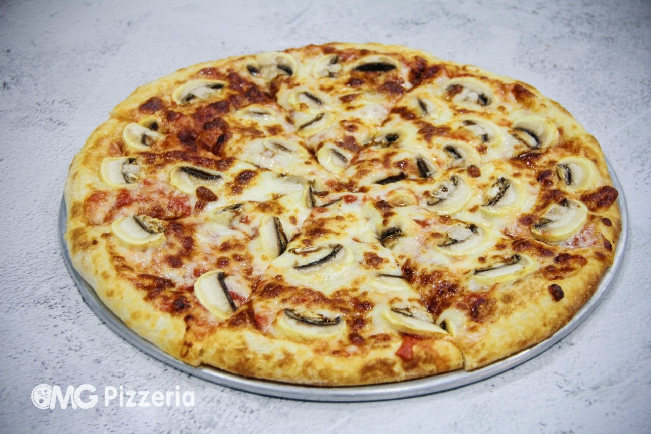 Cheese and mushroom pizza on a round metal tray
