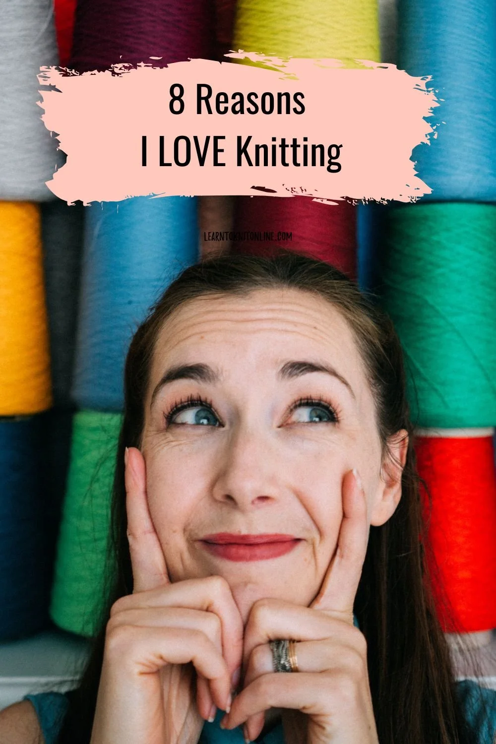 Knitting Teacher Alice, a white woman looks up with a wall of yarn behind her