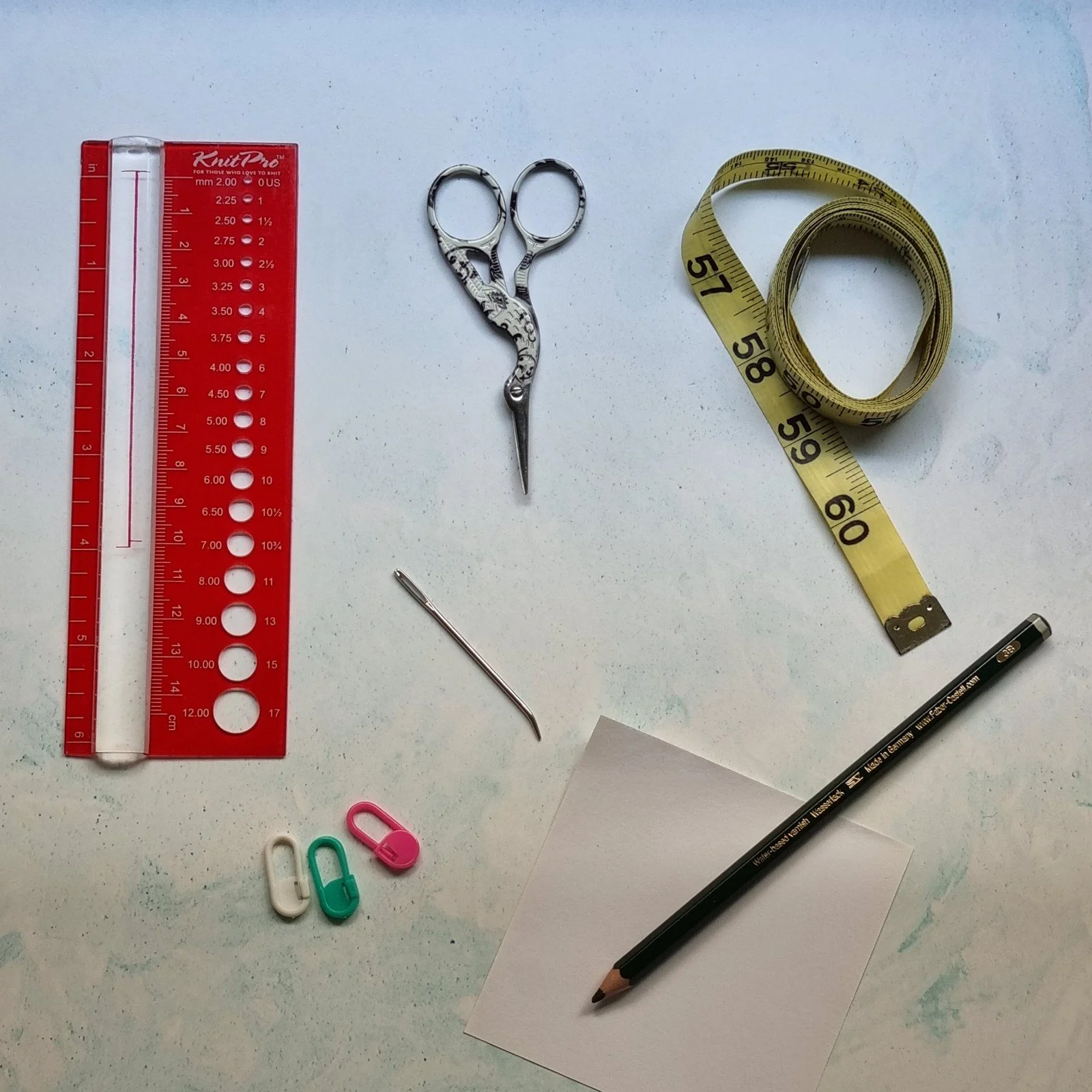 A collection of knitting accessories helpful for knitters