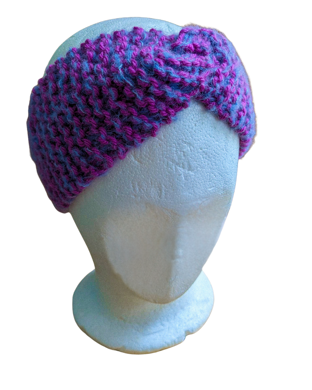 White mannequin head wearing a purple and pink chunky knit hat.