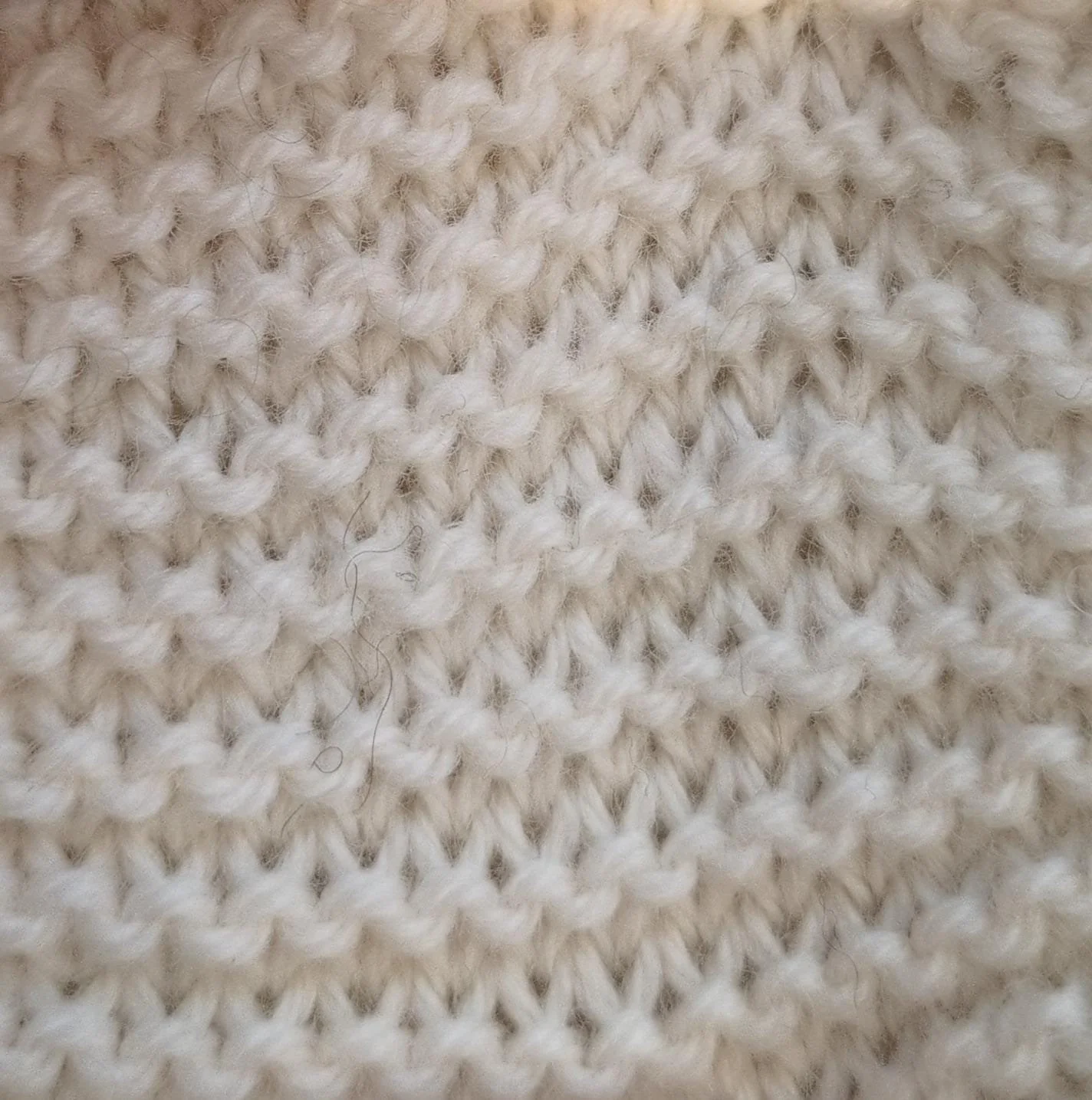 Garter Stitch stretched out to reveal purls and knit stitches