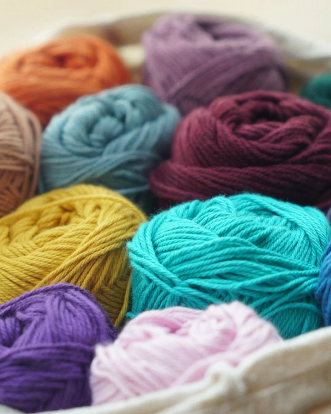 A collection of balls of Cotton Yarns in different colours