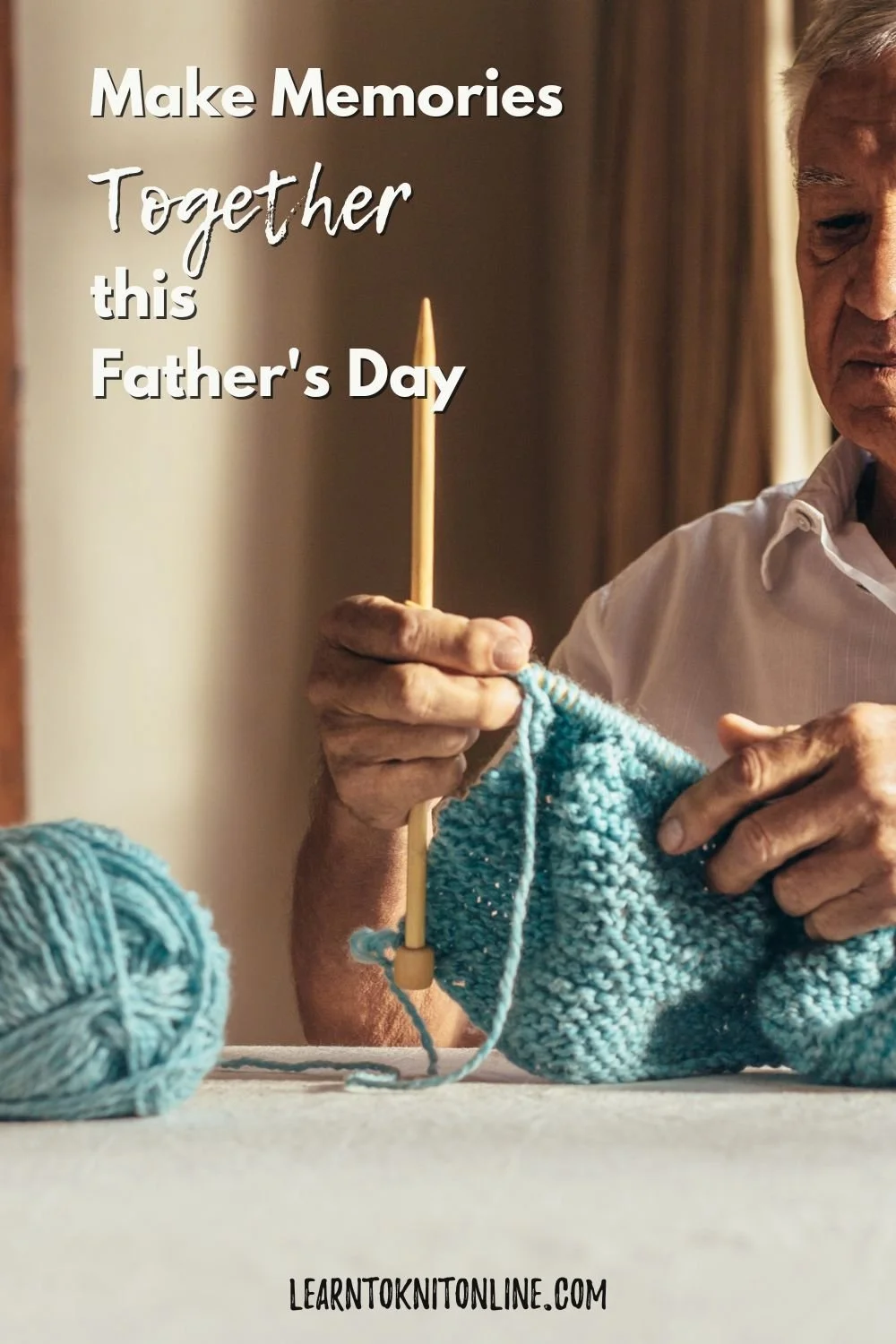 An elderly man holds wooden knitting needles and blue knitting yarn