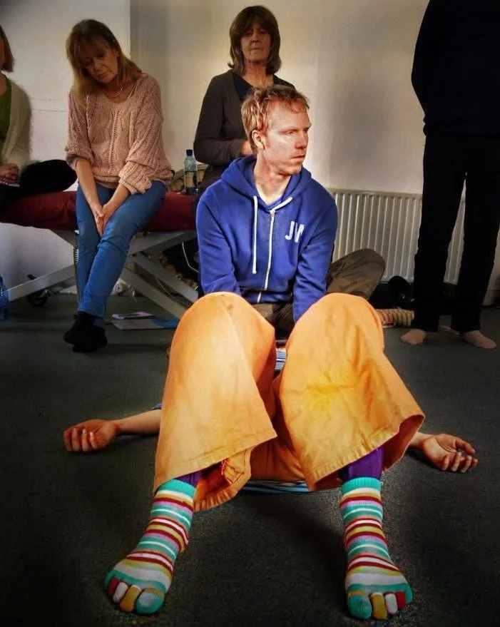 Paul Hand Amatsu trainer demonstrating Amatsu techniques on the floor