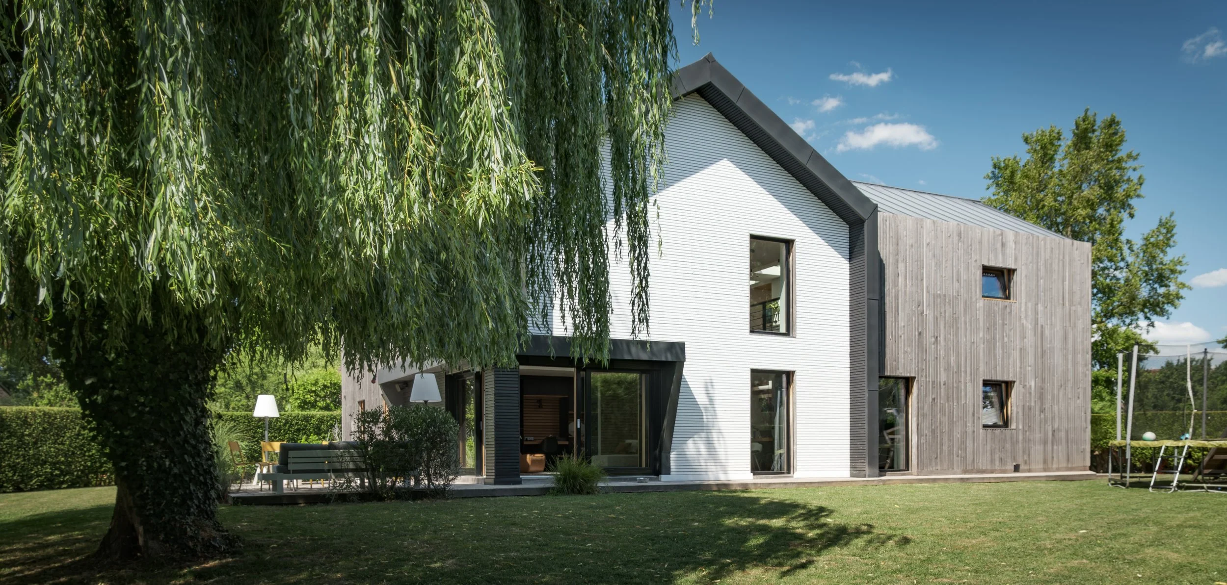 Réhabilitation et surélévation d'une maison individuelle à Bondues