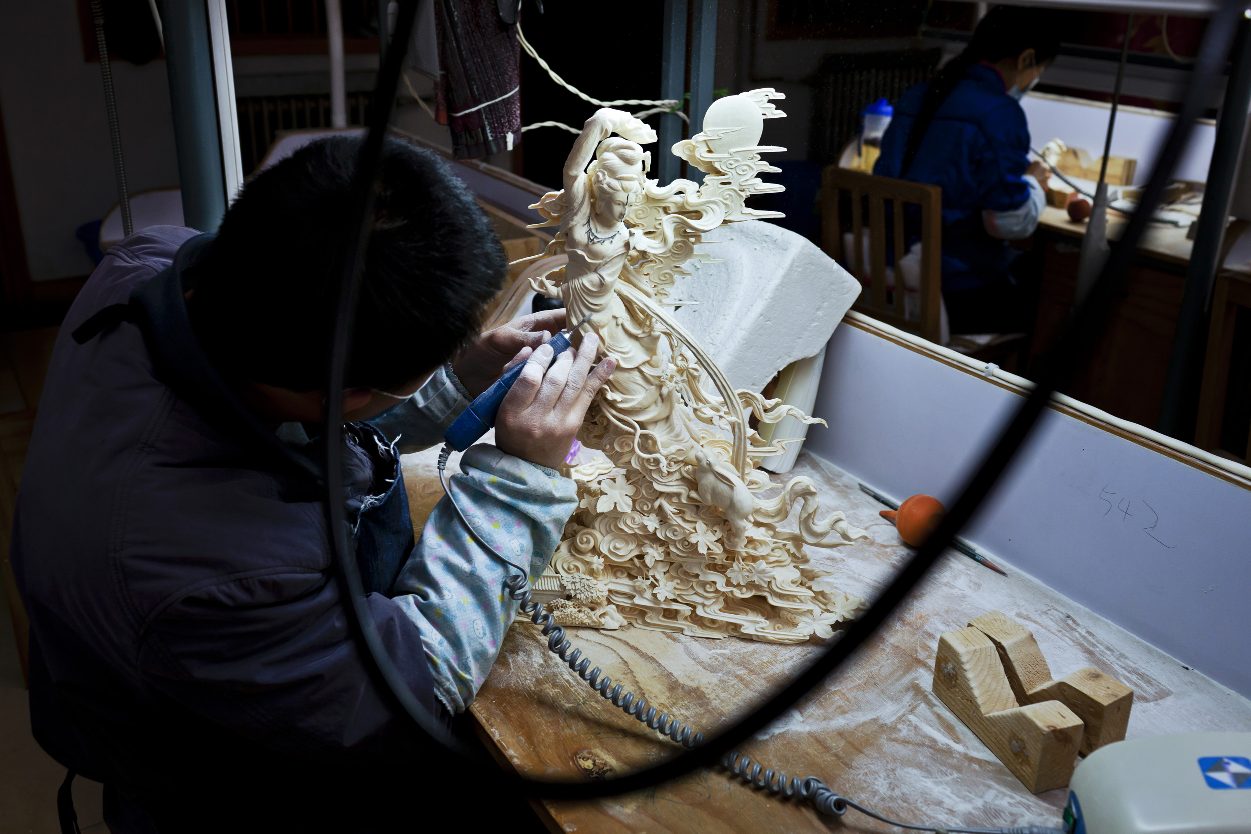 BEIJING, CHINA, NOVEMBER 2011: Scenes from China National Arts and Crafts Corporation - Ivory Carving factory, Beijing, China, November 17. Started in 2009 after China's big African Ivory purchase, this is supposedly the world's largest Ivory carvin