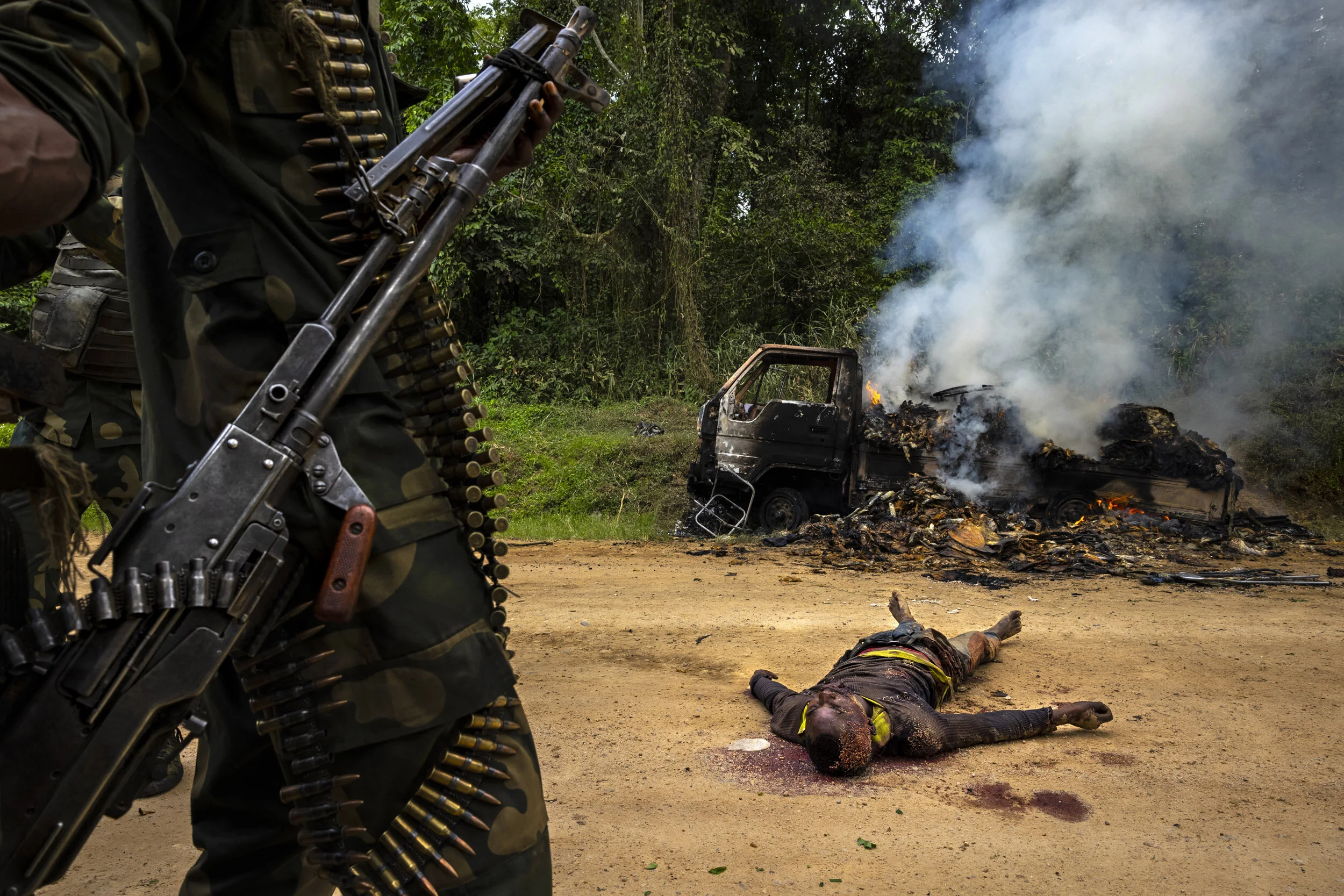 KILYA, RWENZORI SECTOR, DEMOCRATIC REPUBLIC OF CONGO, 9 APRIL 2021: Congolese Army soldiers and UN forces inspect an ambush site where an hour previously A.D.F fundamentalist rebels attacked two vehicles on the road between Beni and the Ugandan bord