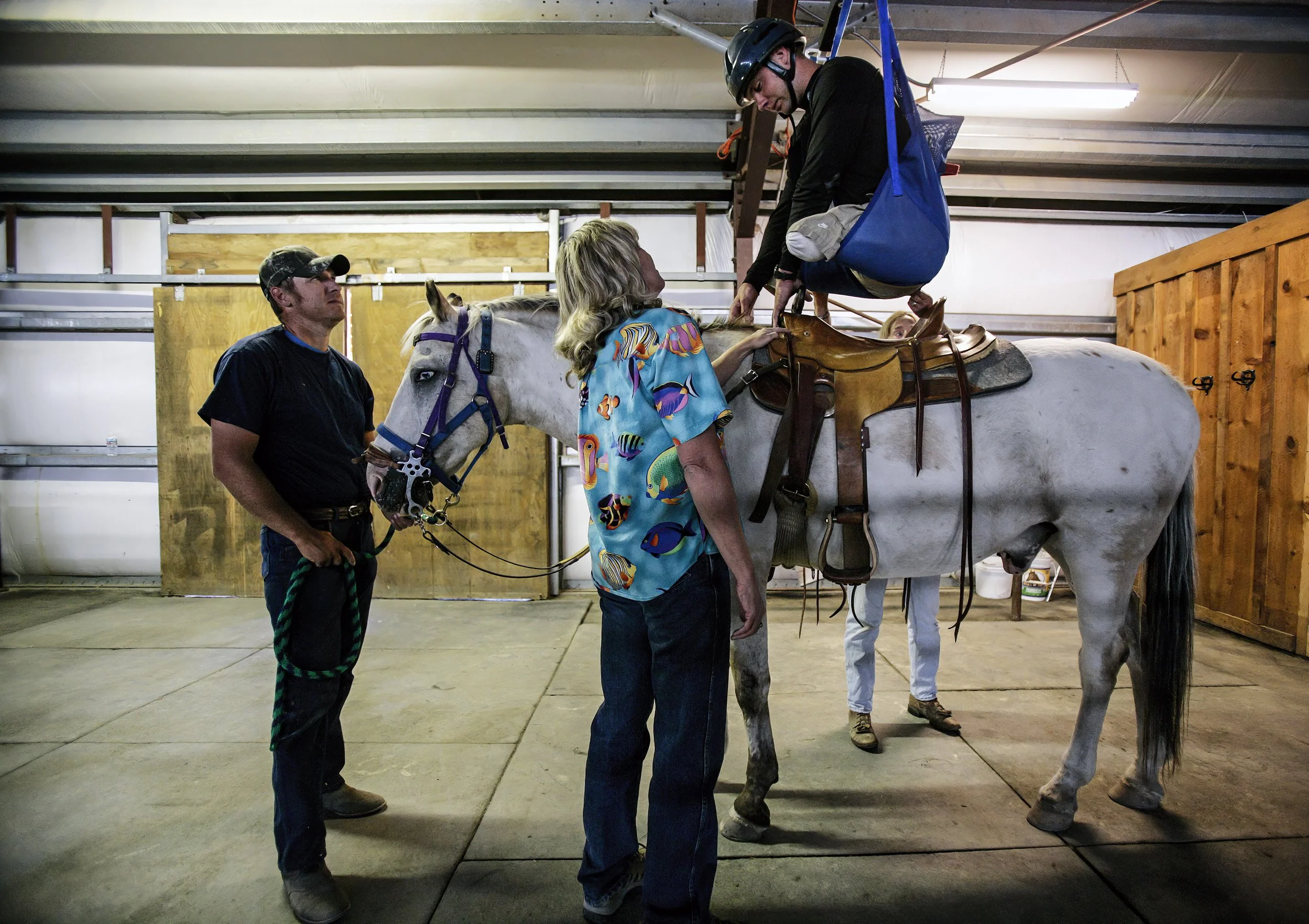 SUN VALLEY, IDAHO - 8/14 AUGUST 2006: Specialist Andy Soule, 25, learns to ride a horse as part of a series of choices he made as to which sports sorts he wanted to pursue as part of a week of outdoor activity. The programm is run by an organisation