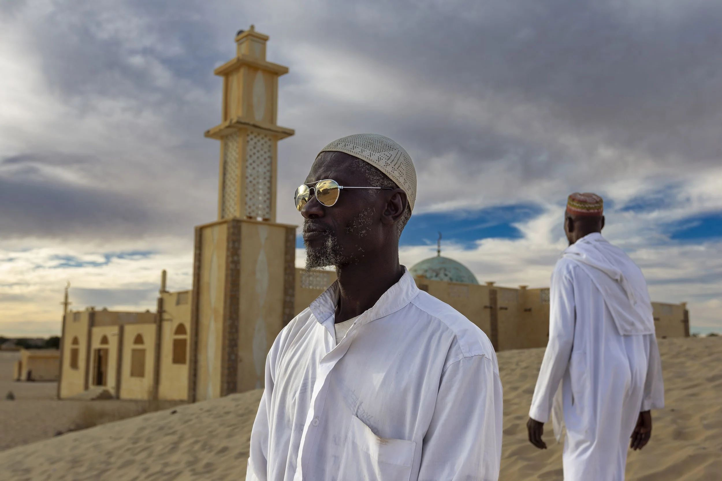TIMBUKTU, MALI, JANUARY 2010: A Mosque and two muslims on the outskirts of Timbuktu, the mythical Northern Mali city, 23 January 2010. (Photo by Brent Stirton/Reportage by Getty images.)