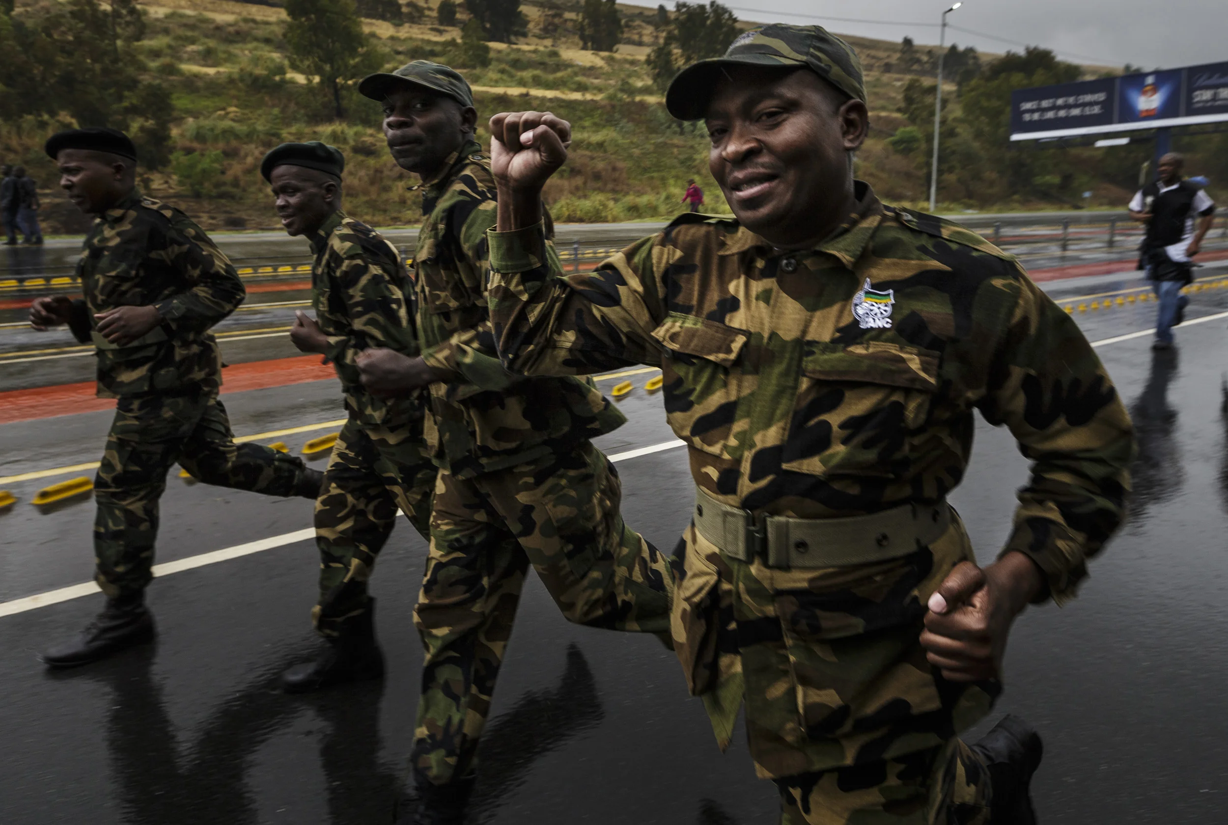 SOWETO, SOUTH AFRICA, 10 DECEMBER 2013: Former member of the armed wing of the ANC run to FNB stadium to be among Mandela supporters for a day of comemoration for Nelson Mandela, the iconic Freedom Fighter of the ANC, Soweto, South Africa, 10 Decemb