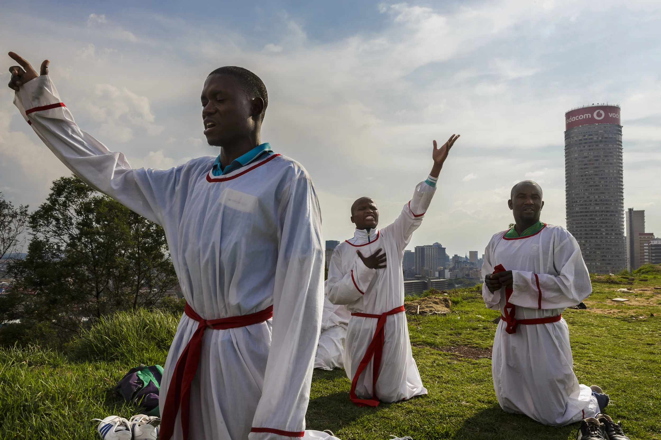 HILLBROW, JOHANNESBURG, SOUTH AFRICA, 7 DECEMBER 2013: African Christians say passionate prayers on a hilltop overlooking Johannesburg, 7 December 2013. There are prayers all over the country at this time as people mourn the loss of Nelson Mandela,