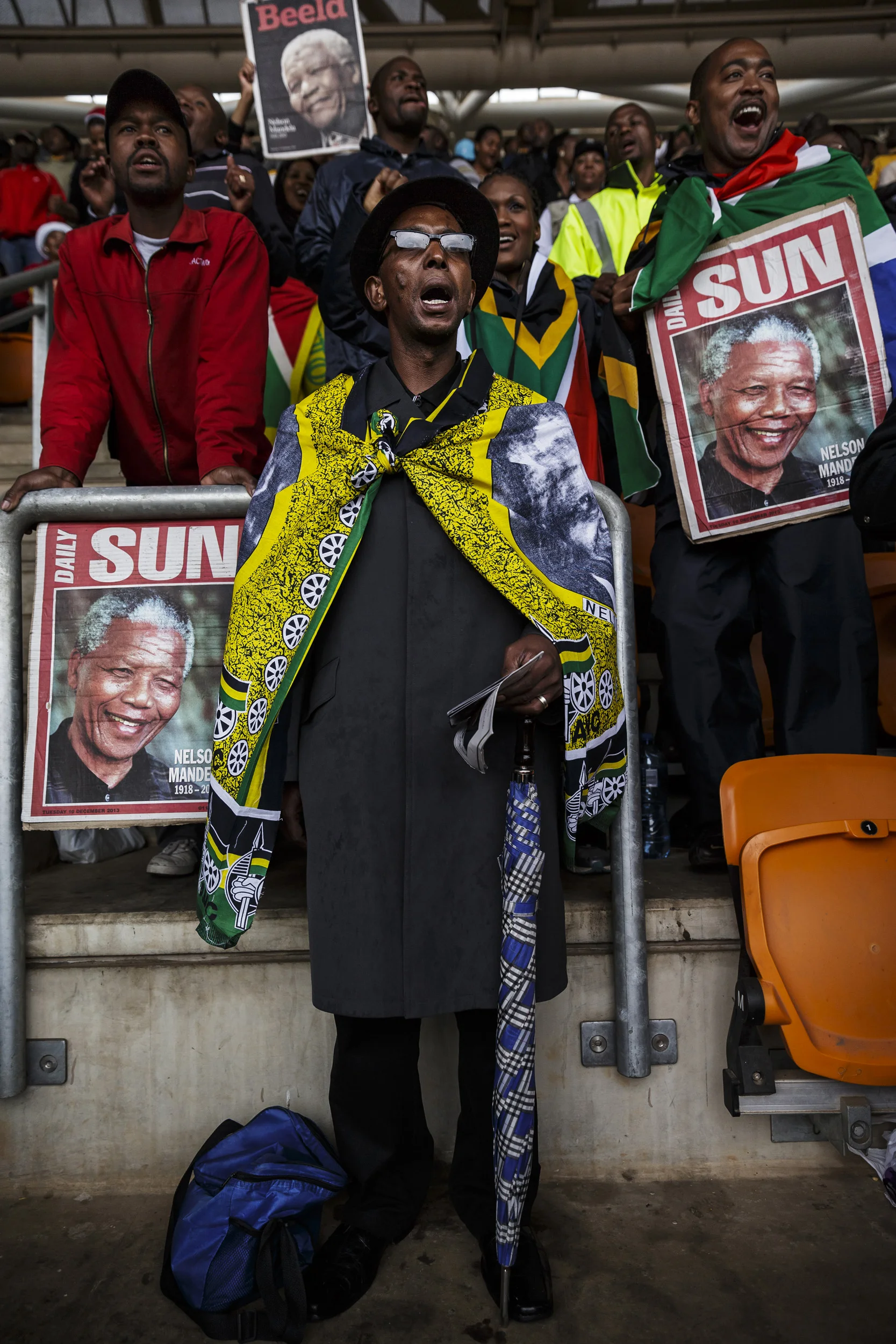 SOWETO, SOUTH AFRICA, 10 DECEMBER 2013: Mandela supporters at FNB stadium for a day of comemoration for Nelson Mandela, the iconic Freedom Fighter of the ANC, Soweto, South Africa, 10 December 2013. Mr Mandela died on the 5th of December 2013.
(Pho
